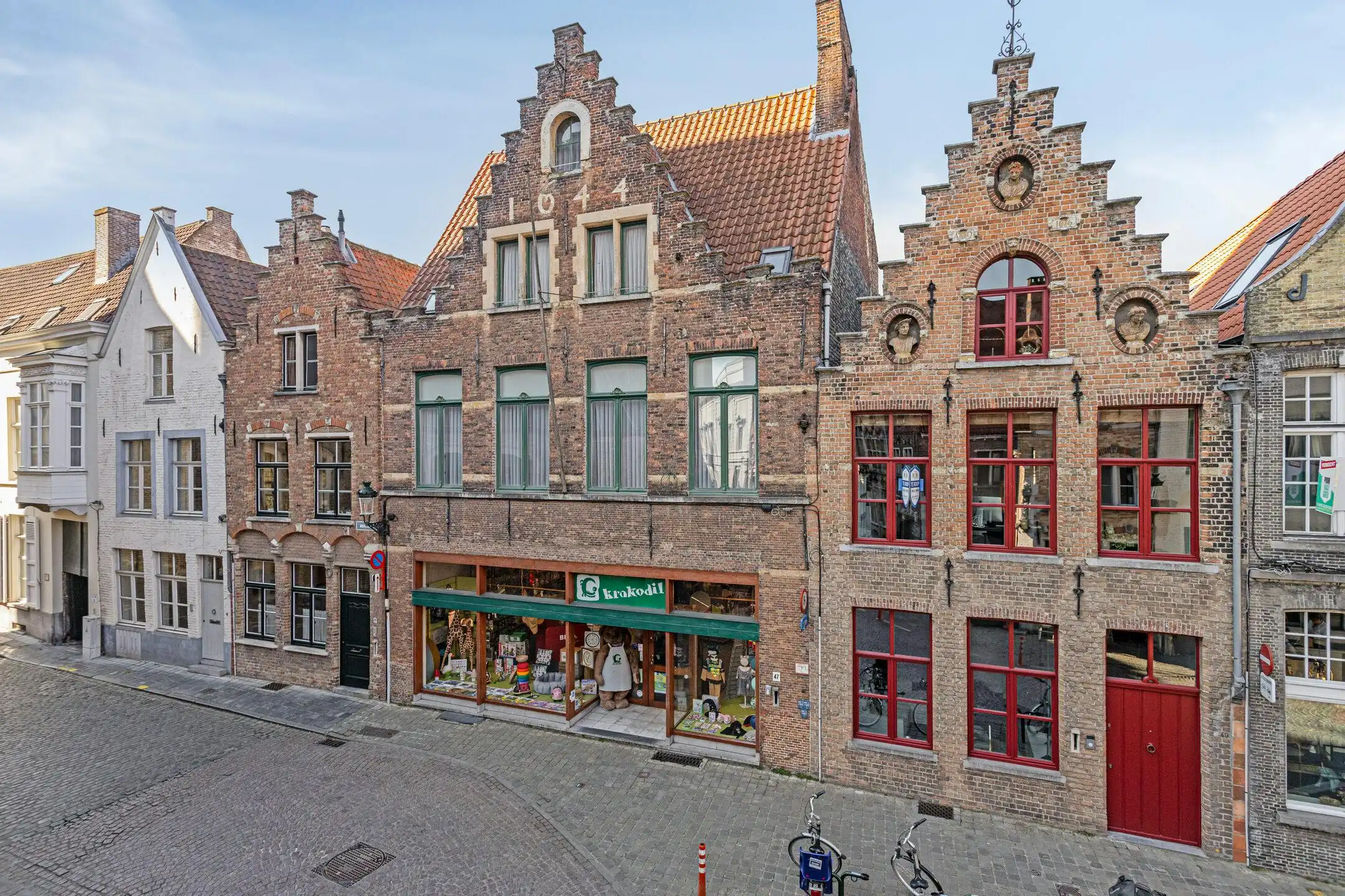 Handelspand met woonst te koop in Brugge foto {{pictureIndex}}