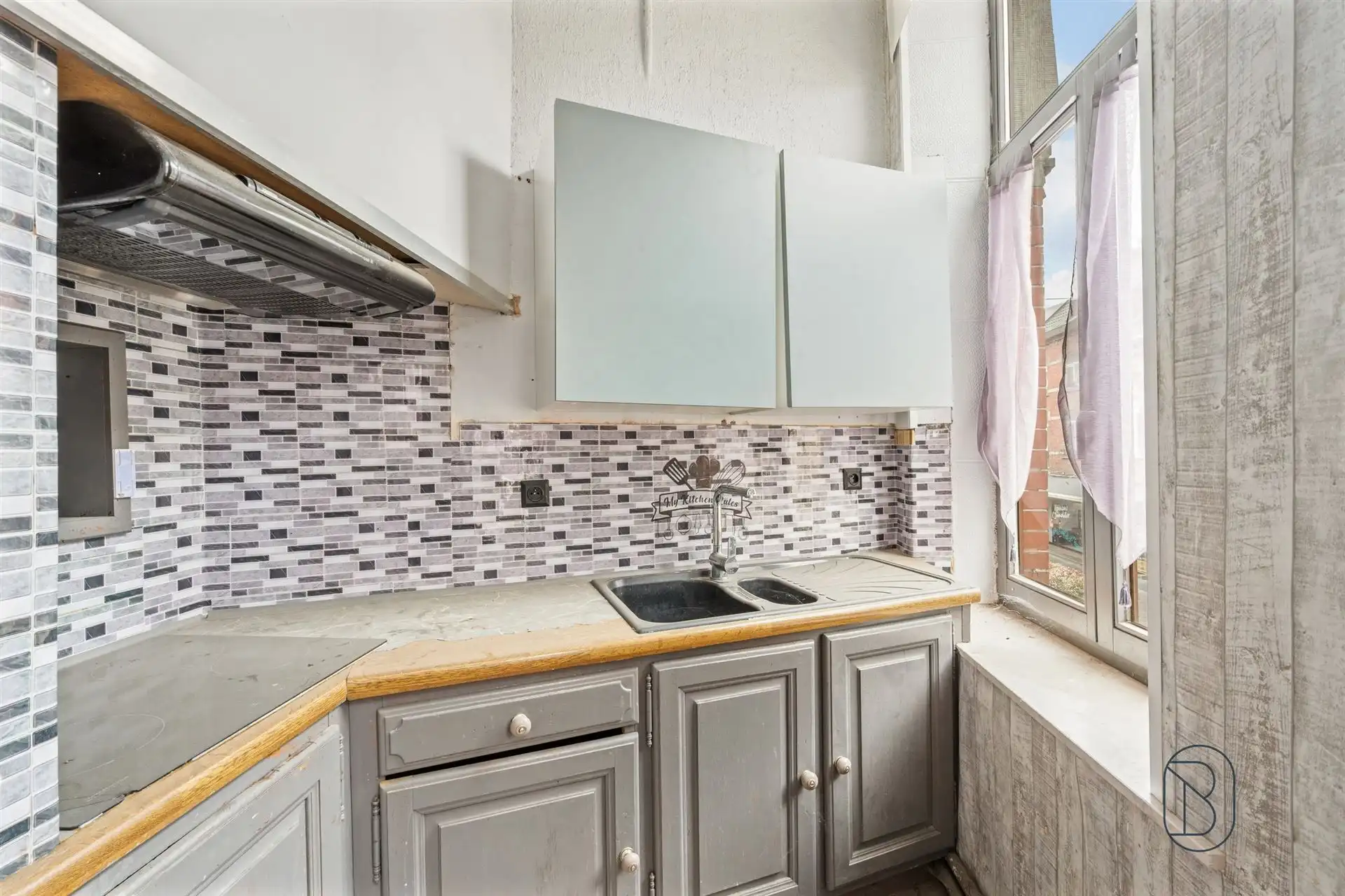 Opbrengsteigendom: handelsruimte en 2 appartementen foto 11