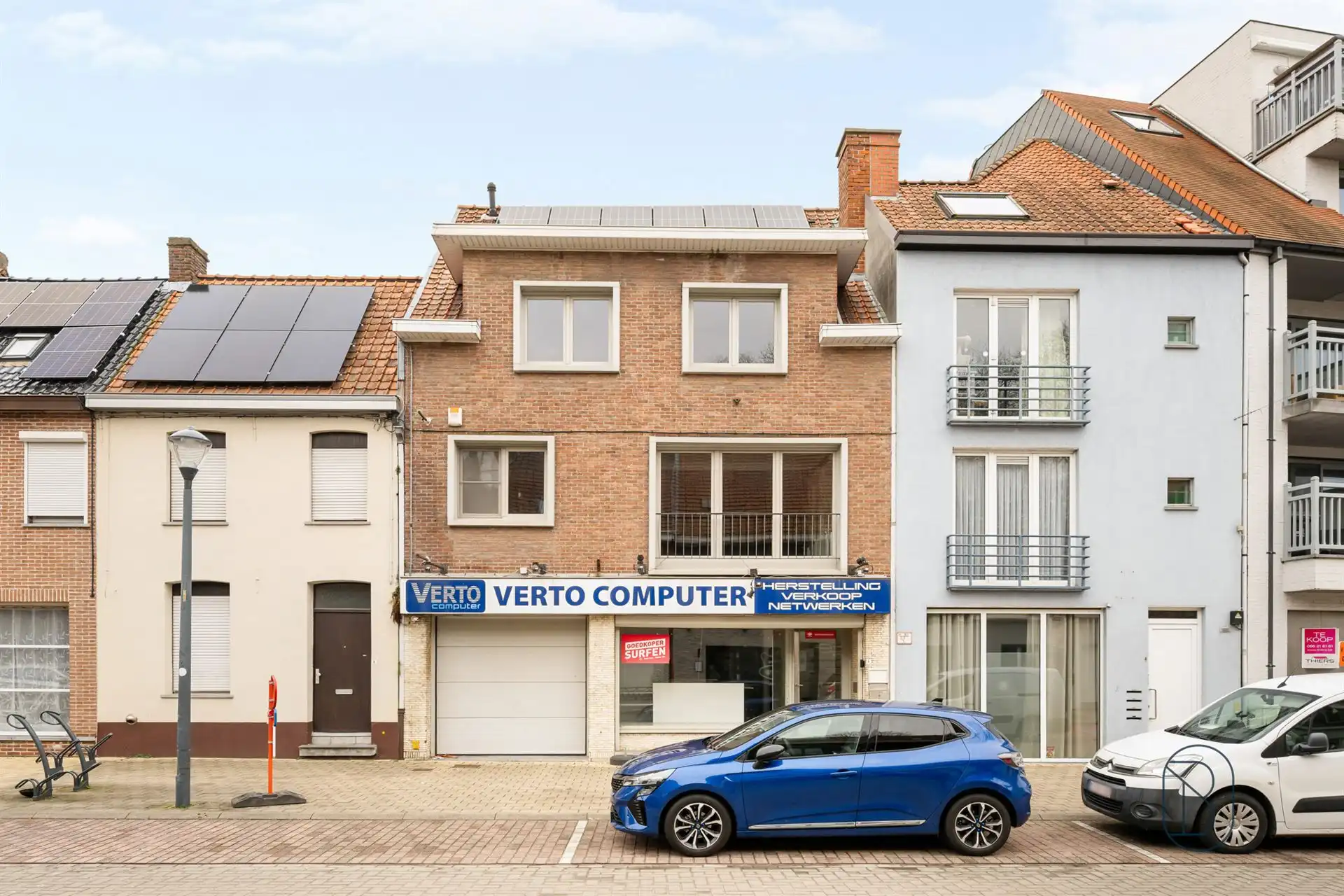Handelspand met ruime woonst, garage en leuk terras foto 2