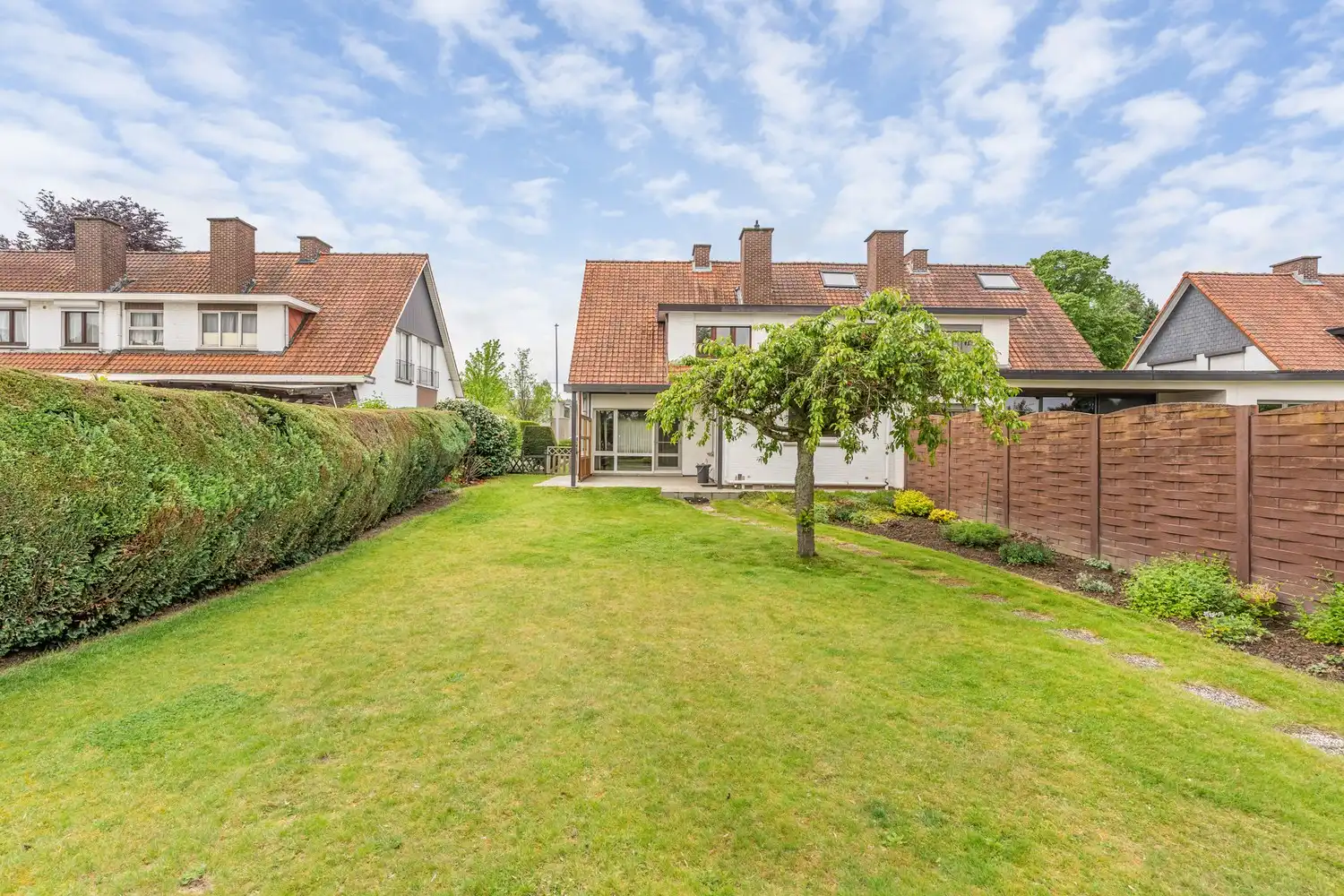 Goed gelegen woning met 4 slaapkamers, een garage en een diepe tuin in een verkeersluwe straat te Kessel-Lo! foto 26
