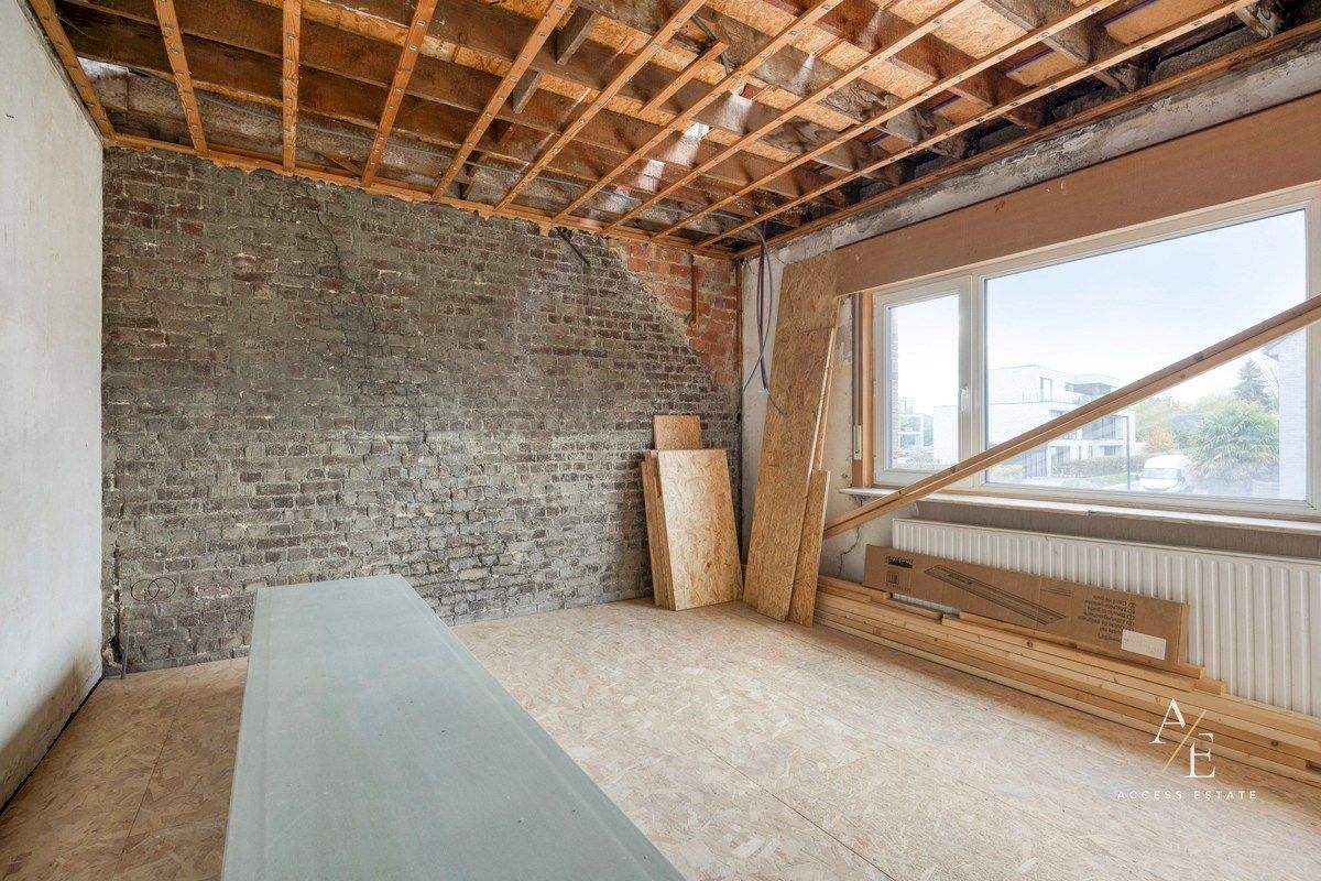 Ruime halfopen woning met potentieel in rustige straat te Melle foto 13