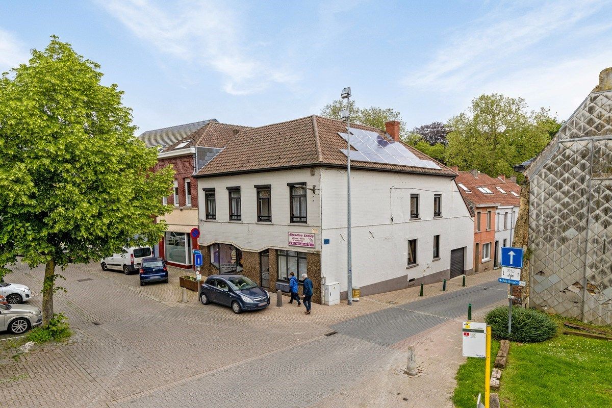 Goed gelegen opbrengsteigendom met handelszaak en 3 appartementen foto 1