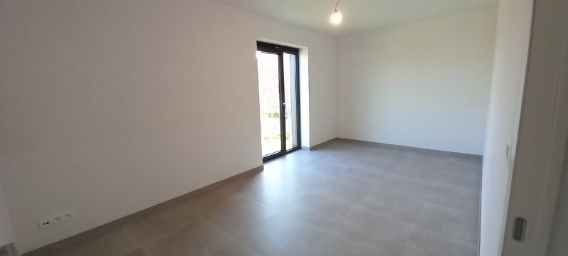 Dit appartement is gelegen langsheen de Langerbrugsestraat te Evergem. foto 10