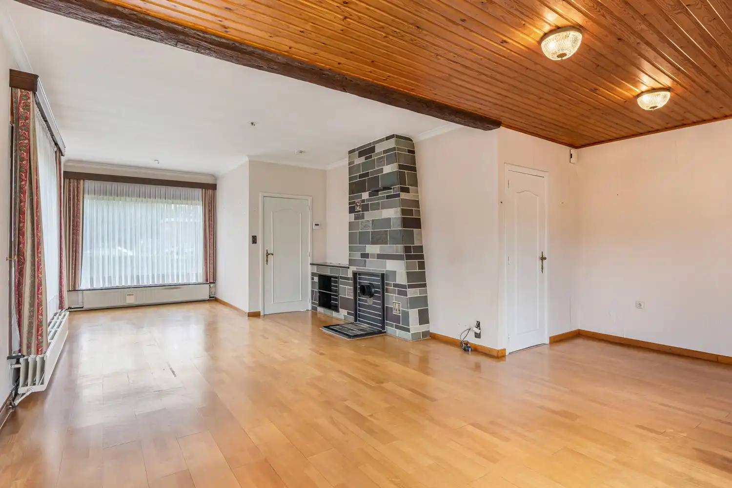 Goed gelegen woning met 4 slaapkamers, een garage en een diepe tuin in een verkeersluwe straat te Kessel-Lo! foto 12