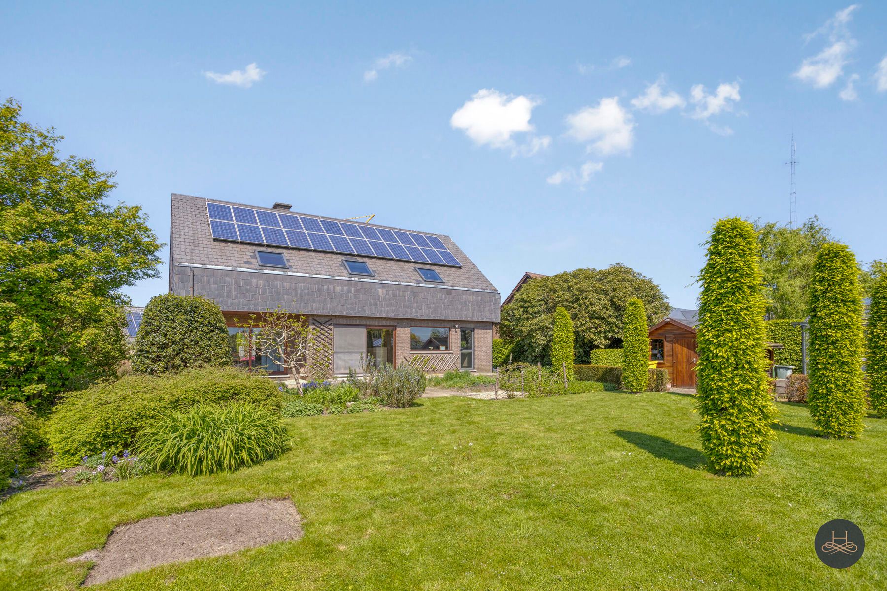 Vrijstaande woning met prachtig aangelegde zuidgerichte tuin foto 24