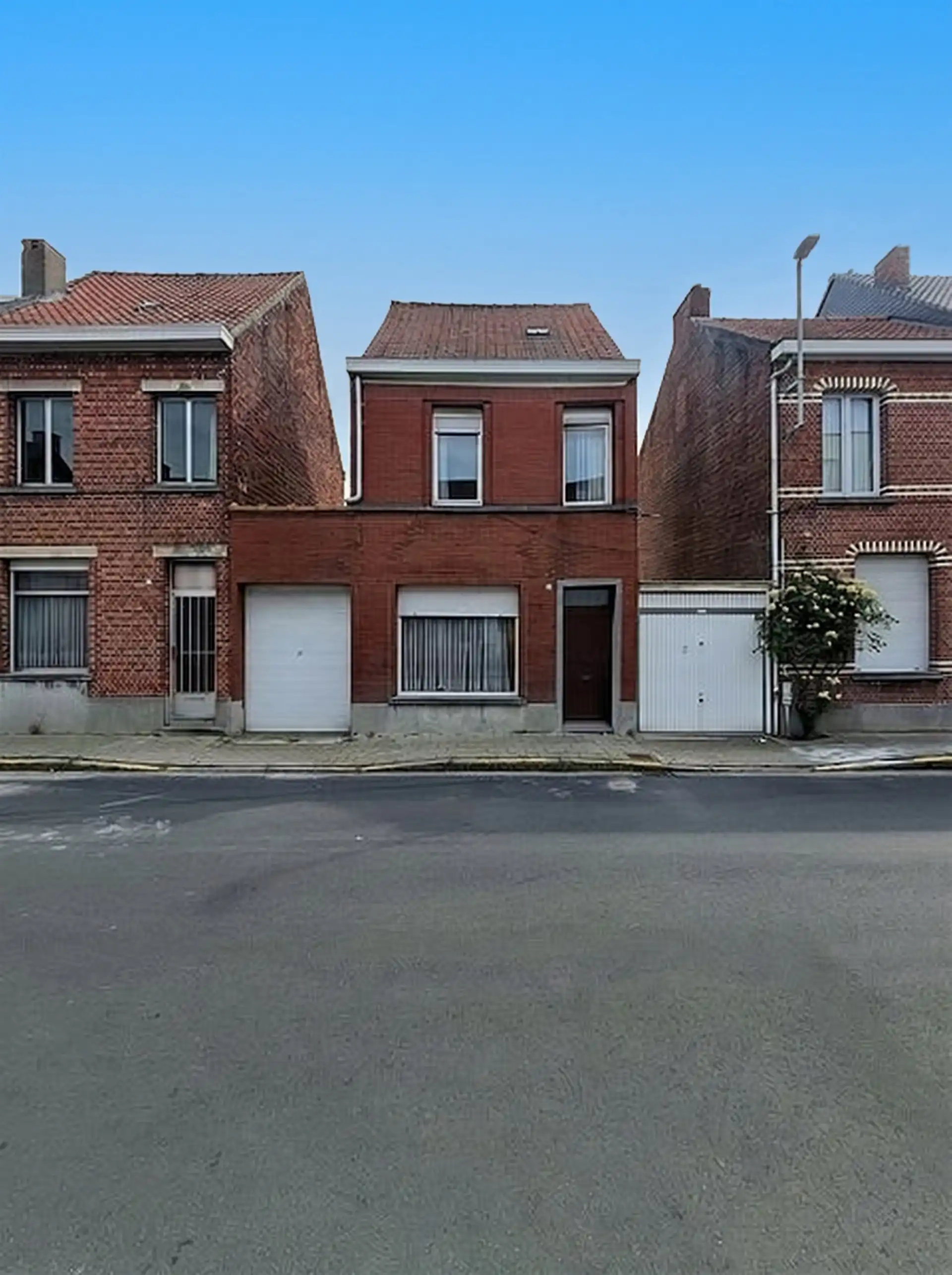 Leuke woning met veel potentieel, garage en tuin in het centrum van Beveren! foto 23