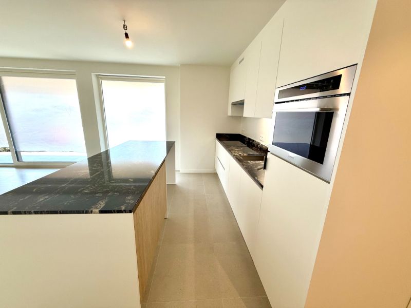Gelijkvloers nieuwbouwappartement met 1 slaapkamer, zonnig terras en carport foto 9