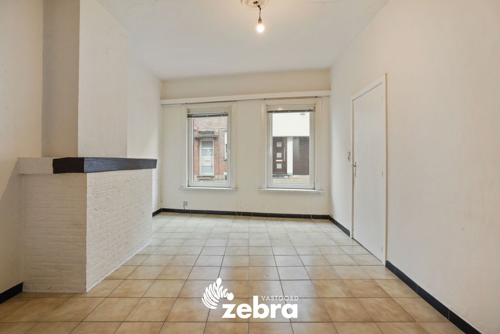 Deels gerenoveerde woning met twee slaapkamers te centrum Tielt! foto 4