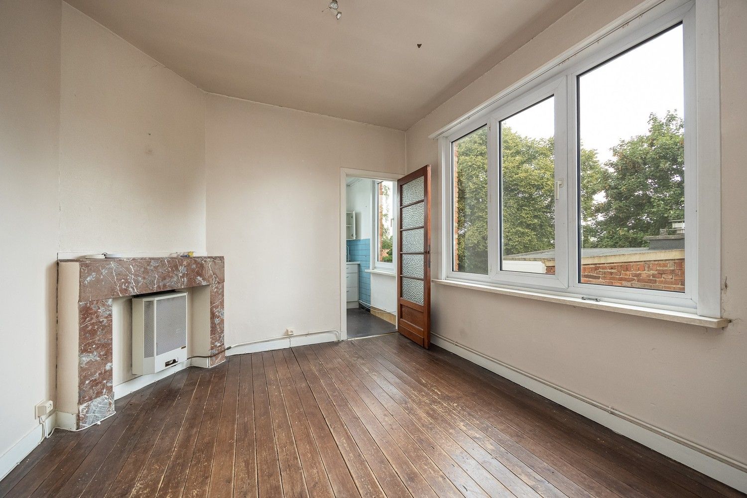 Te renoveren opbrengsteigendom met 3 éénslaapkamerappartementen nabij het Boekenbergpark foto 18