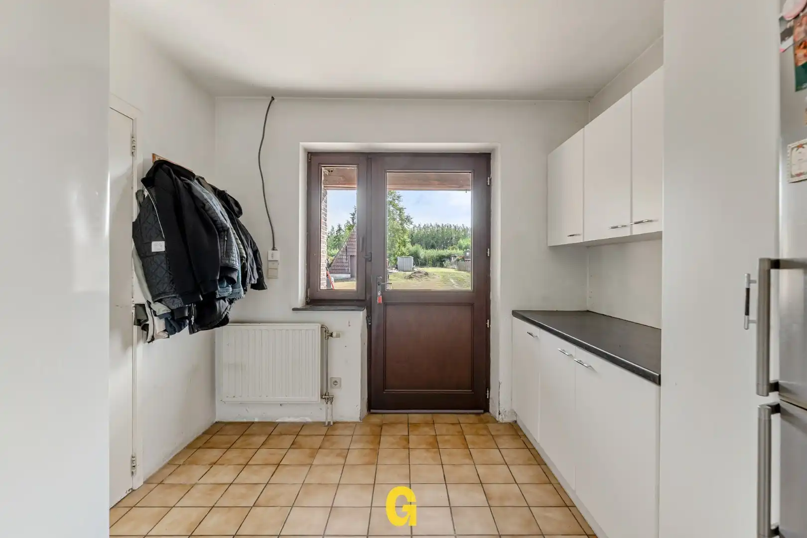 Degelijke halfopen woning met 4 slaapkamers, bureel en ruime tuin met blijvend vrij uitzicht foto 13