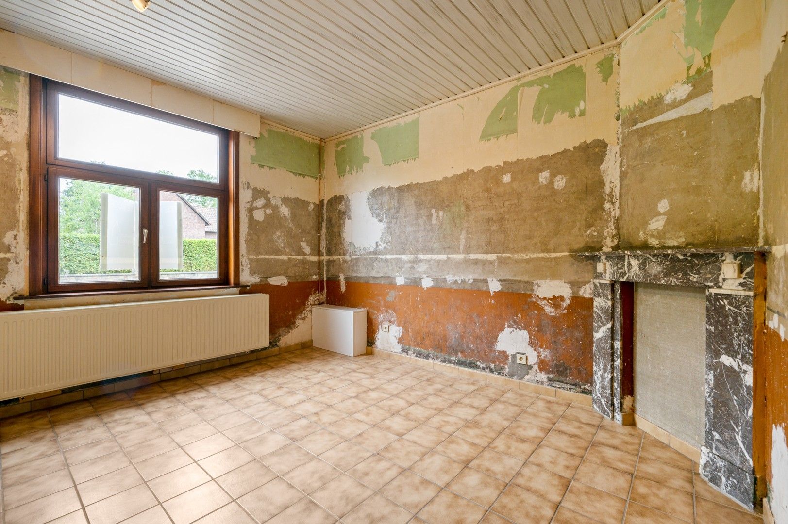 Te renoveren woning met tuin en garage in Wolfsdonk! foto 3