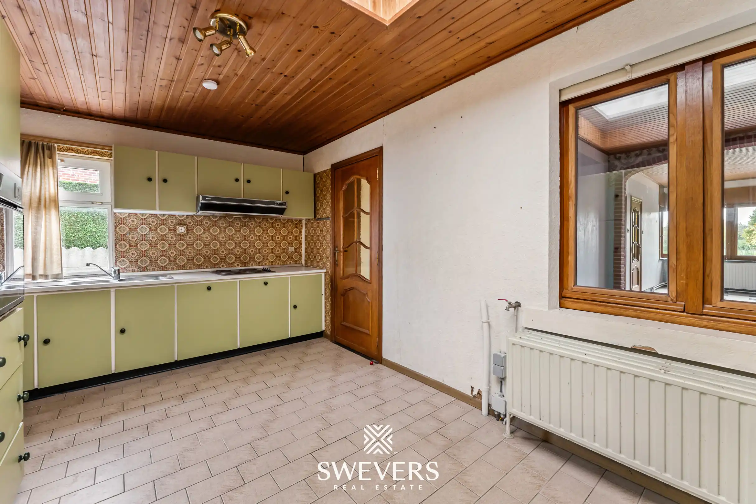 Woning met veel potentieel en ruime tuin in Borgloon foto 14