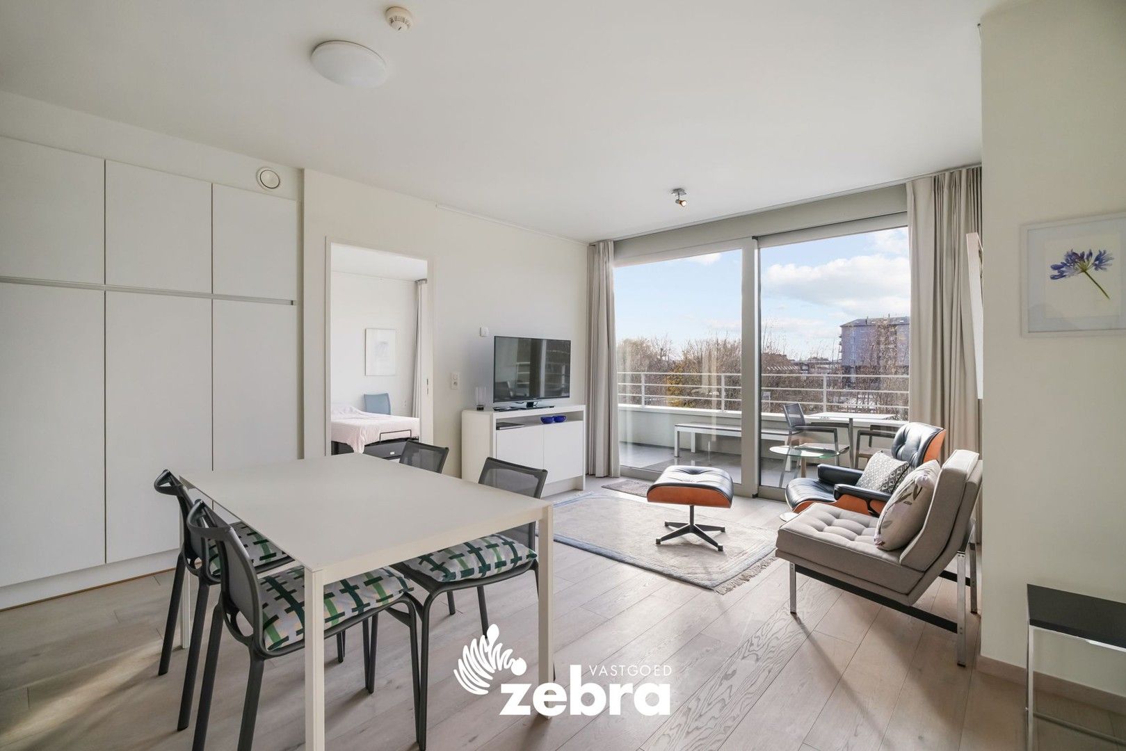 Moderne serviceflat met prachtig zicht op de Leie en autostaanplaats te Deinze! foto {{pictureIndex}}