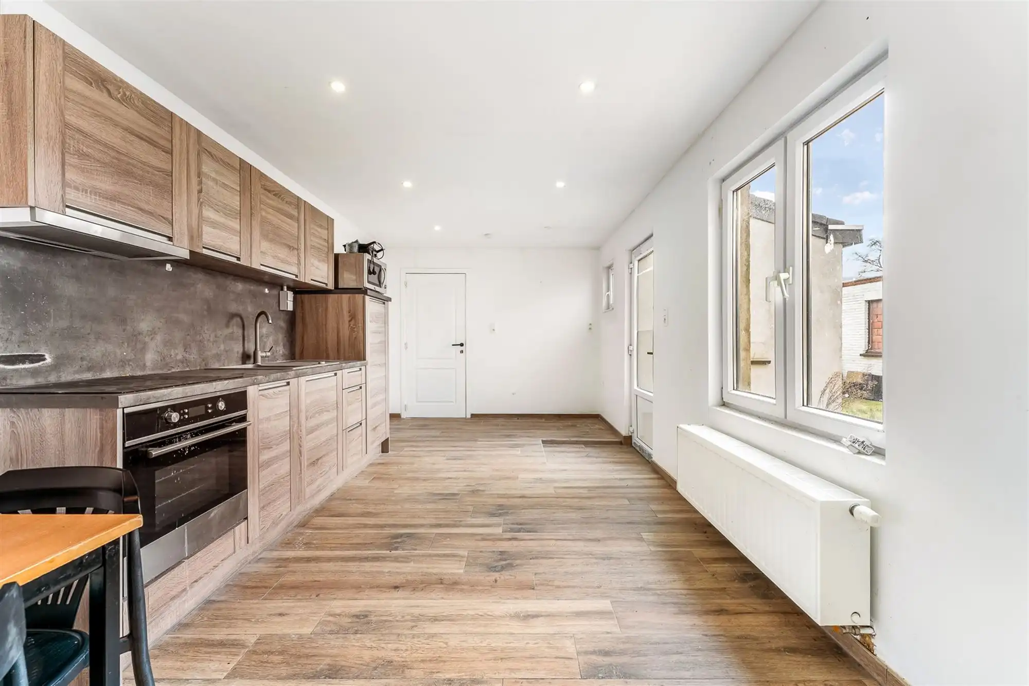 HANDELSHUIS MET RUIM HANDELSPAND EN 2 WOONENTITEITEN OP PERCEEL VAN 9A68CA TE KOERSEL foto 35