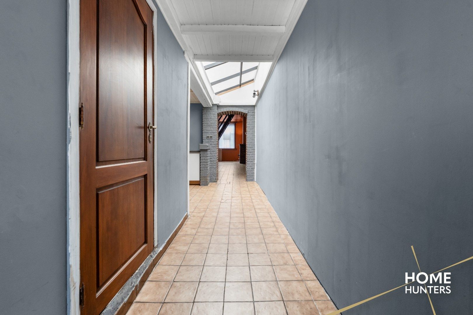 Charmante te renoveren rijwoning met 3 slaapkamers en diepe tuin op centrale ligging in Menen foto 12