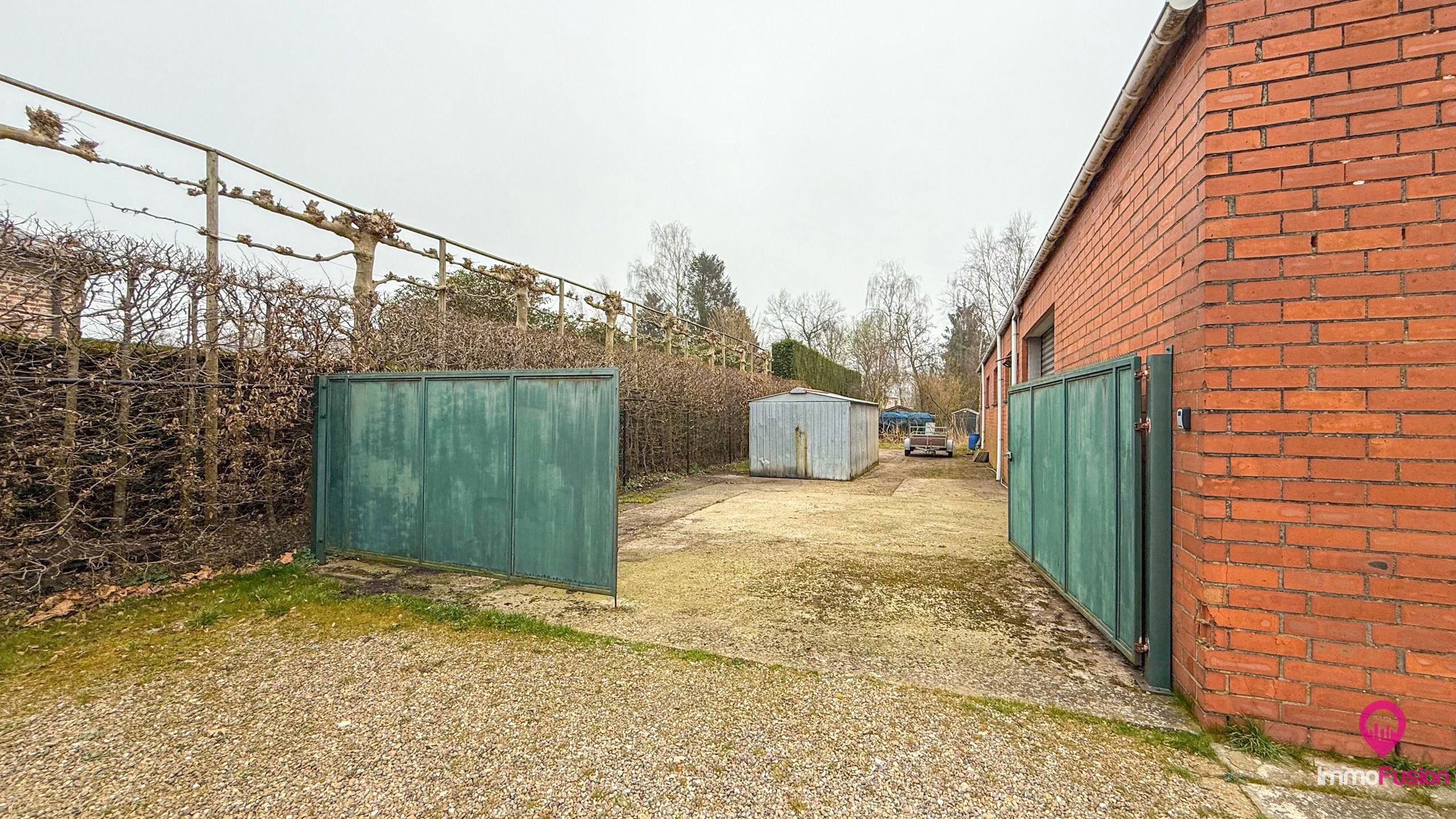 Prachtige brede bouwgrond met magazijn op 20 are! foto 32