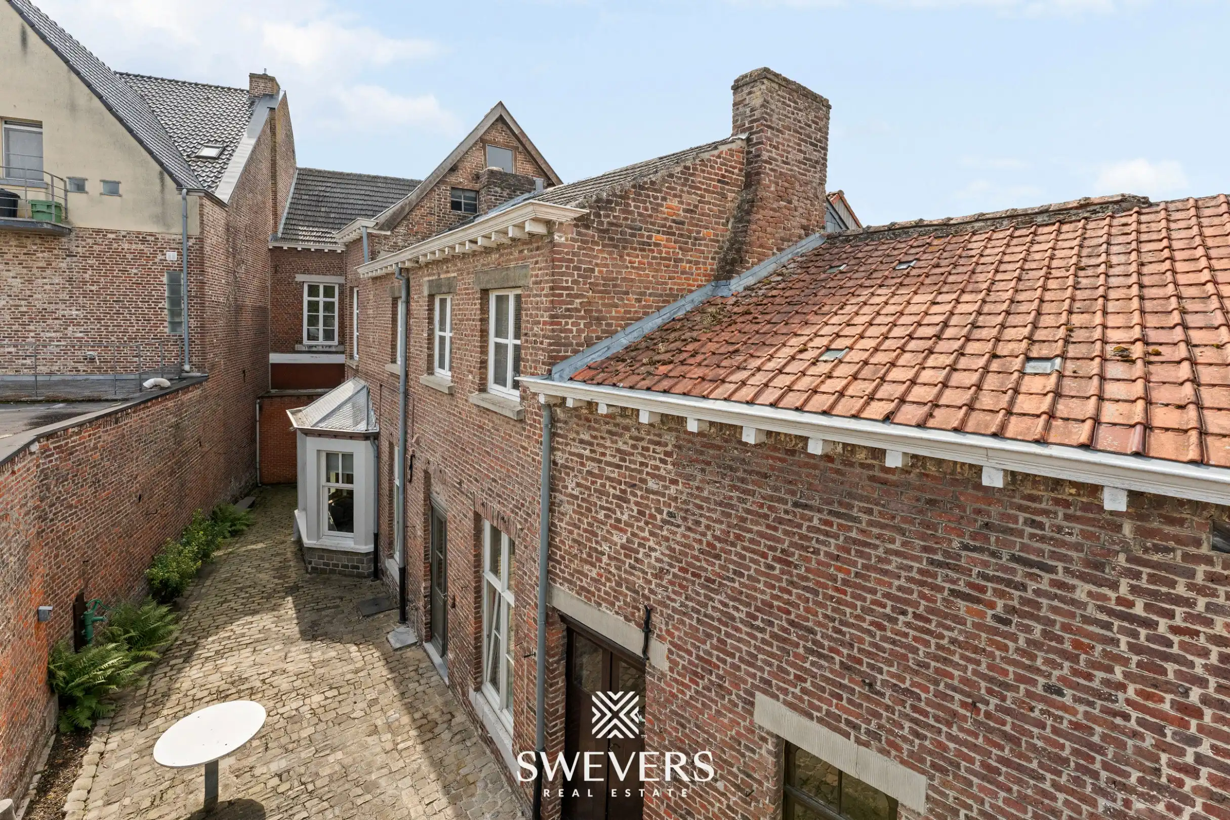 Karaktervol herenhuis met 346 m² woonruimte en uitzonderlijk renovatiepotentieel in centrum Borgloon foto 46