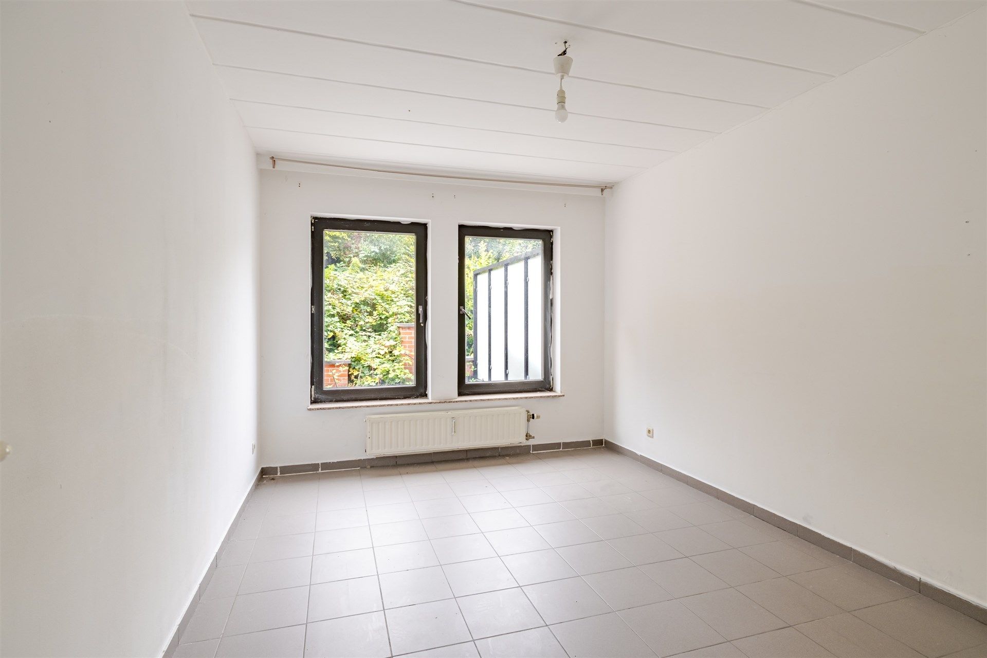 Opbrengsteigendom bestaande uit 6 ruime appartementen + 7 ondergrondse autostaanplaatsen foto 4