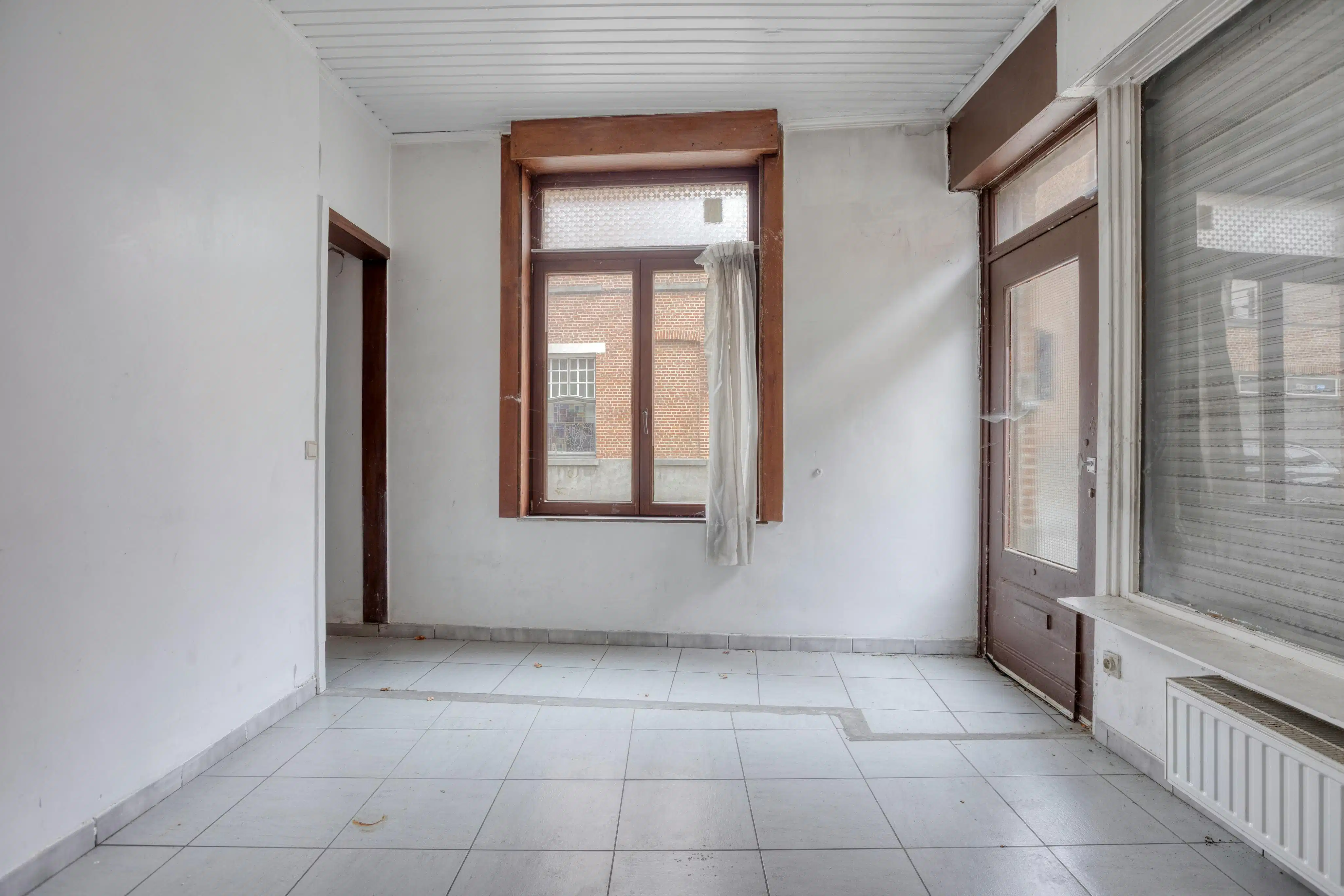 Te renoveren woning te koop in Brugge nabij de Vesten foto 2