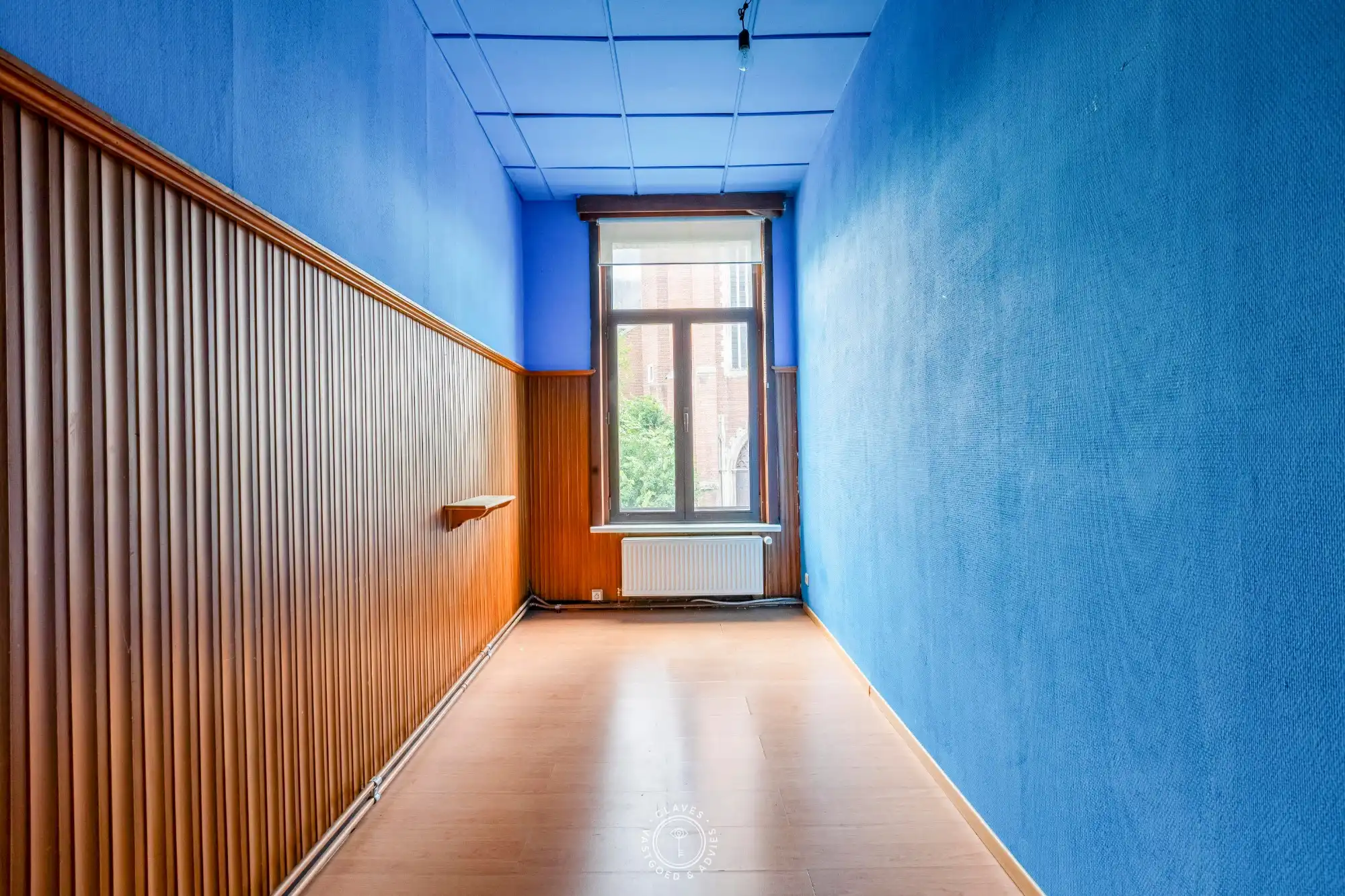 Karaktervol handelspand met woonst op topligging tegenover kerkplein foto 13