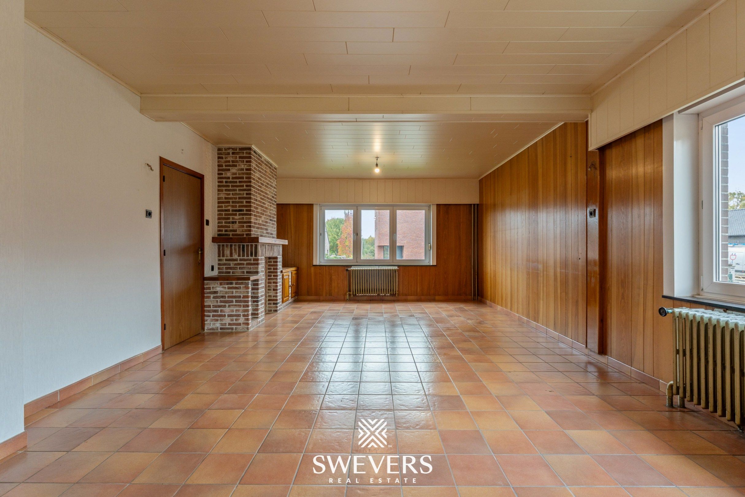 Ruime open bebouwing met potentieel en zuidgerichte tuin in rustige wijk van Houthalen foto 3