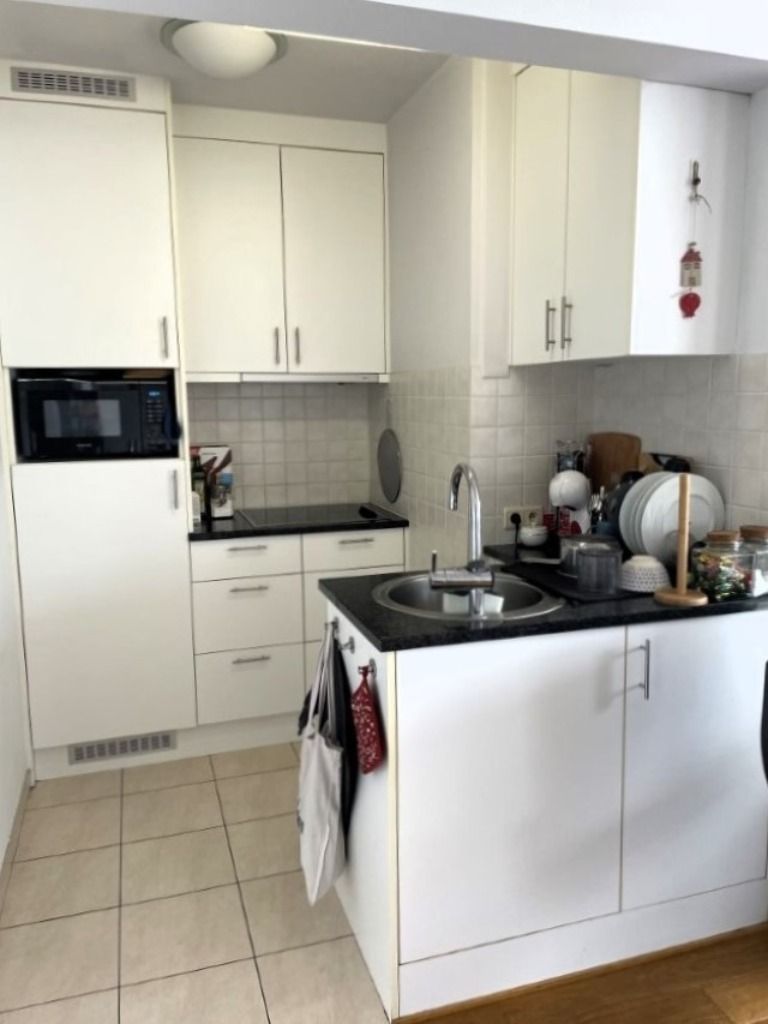 Instapklare flat van 45m² met aparte slaaphoek - incl. autostaanplaats en kelder foto 6