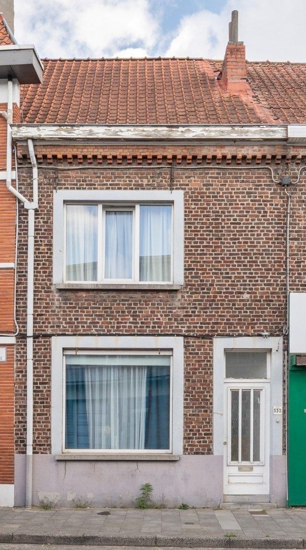 Op te frissen rijwoning met tuin foto 14