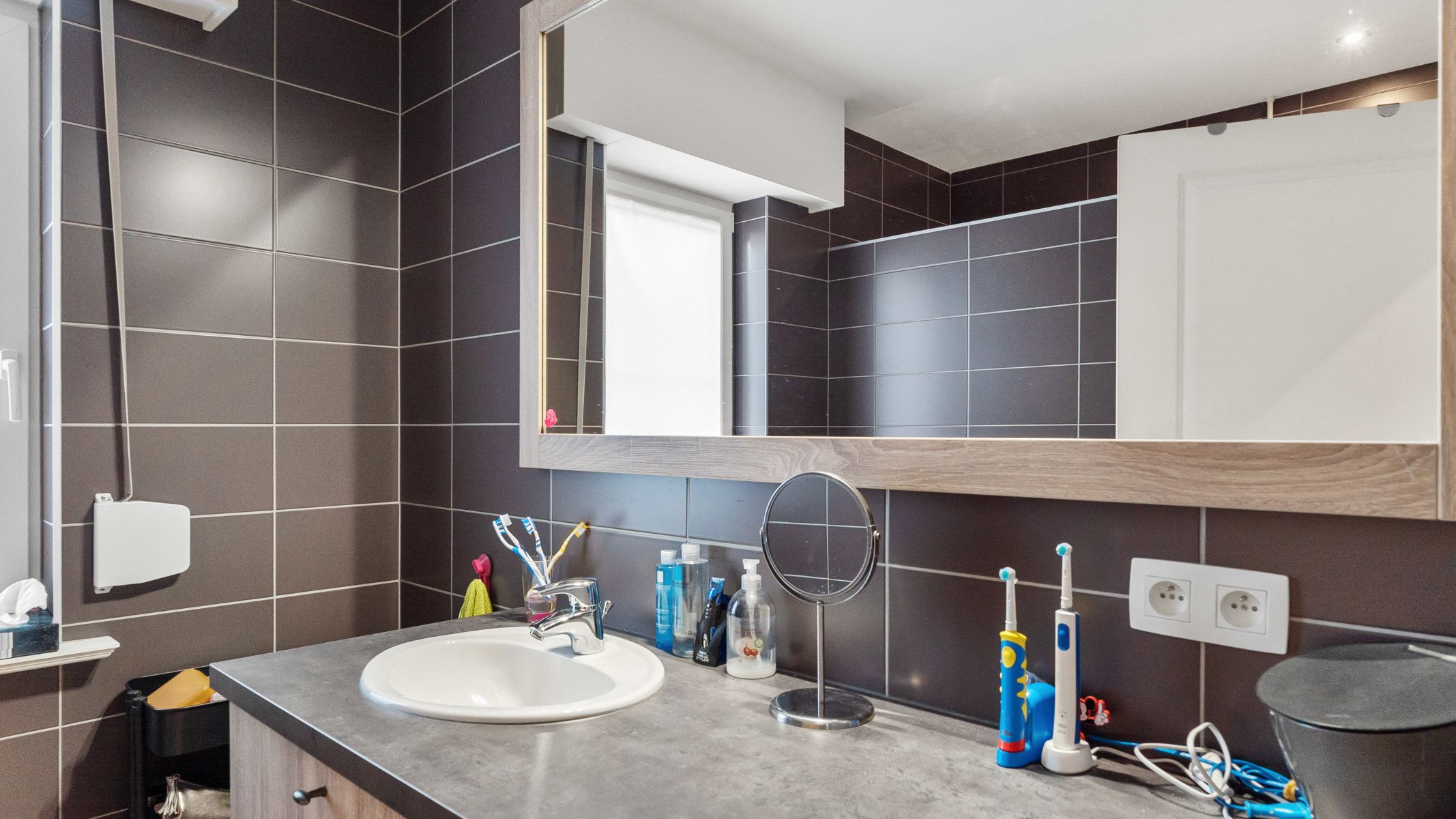 Gelijkvloers appartement met tuin en 2 autostaanplaatsen (1 ondergronds met berging en 1 bovengronds) foto 11