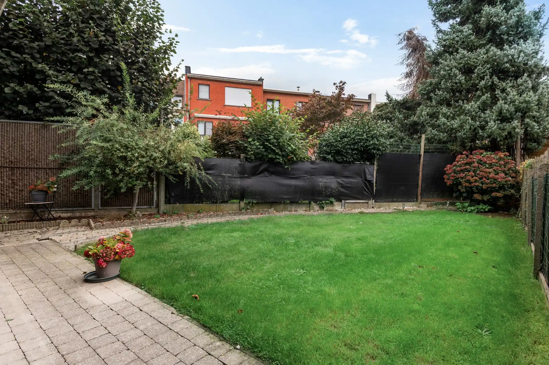 Gelijkvloersappartement met zonnige tuin, garage en staanplaats foto 3