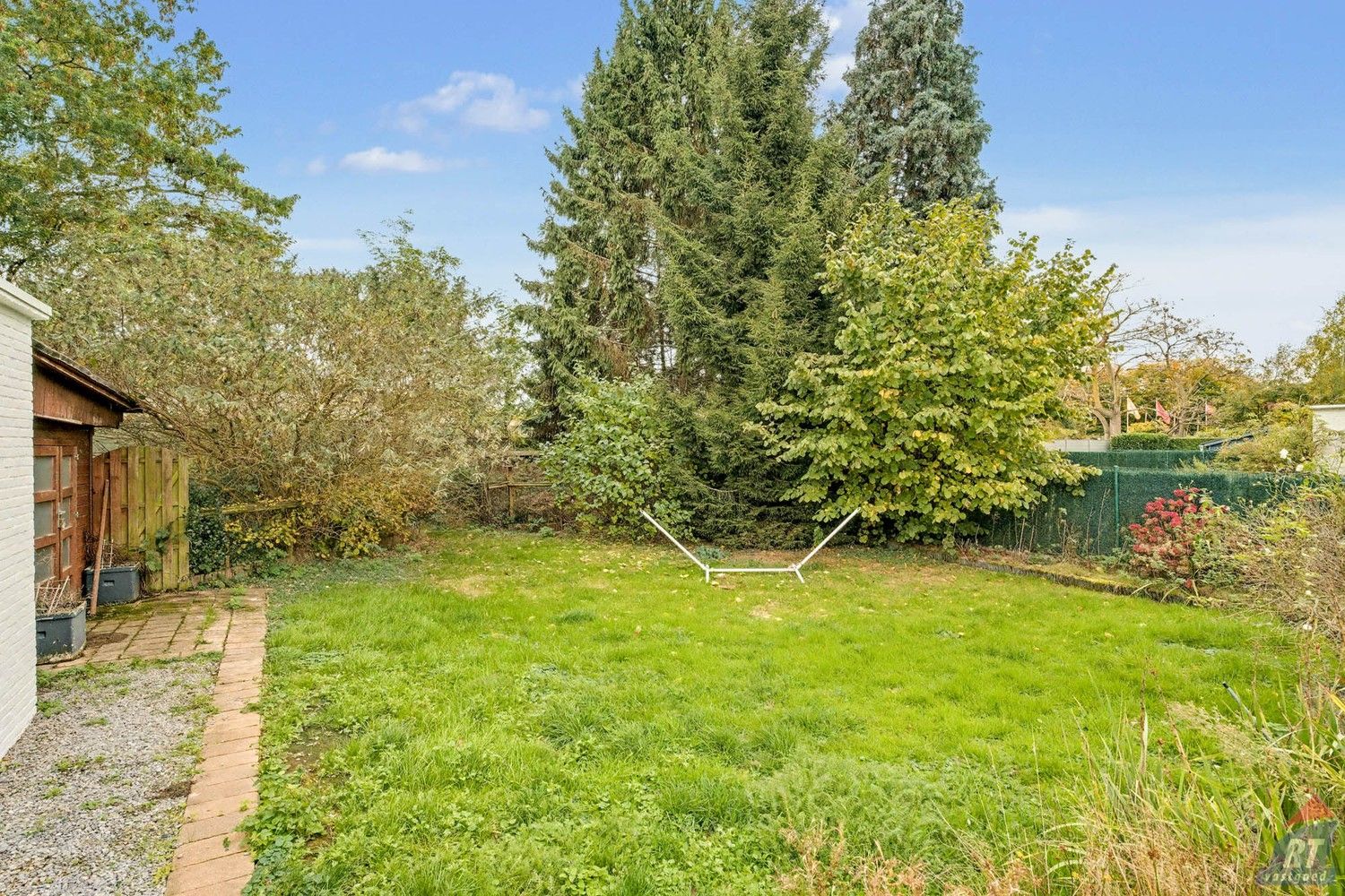 Gelijkvloerse halfopen woning met tuin en renovatiepotentieel in het hart van Sint-Truiden foto 20