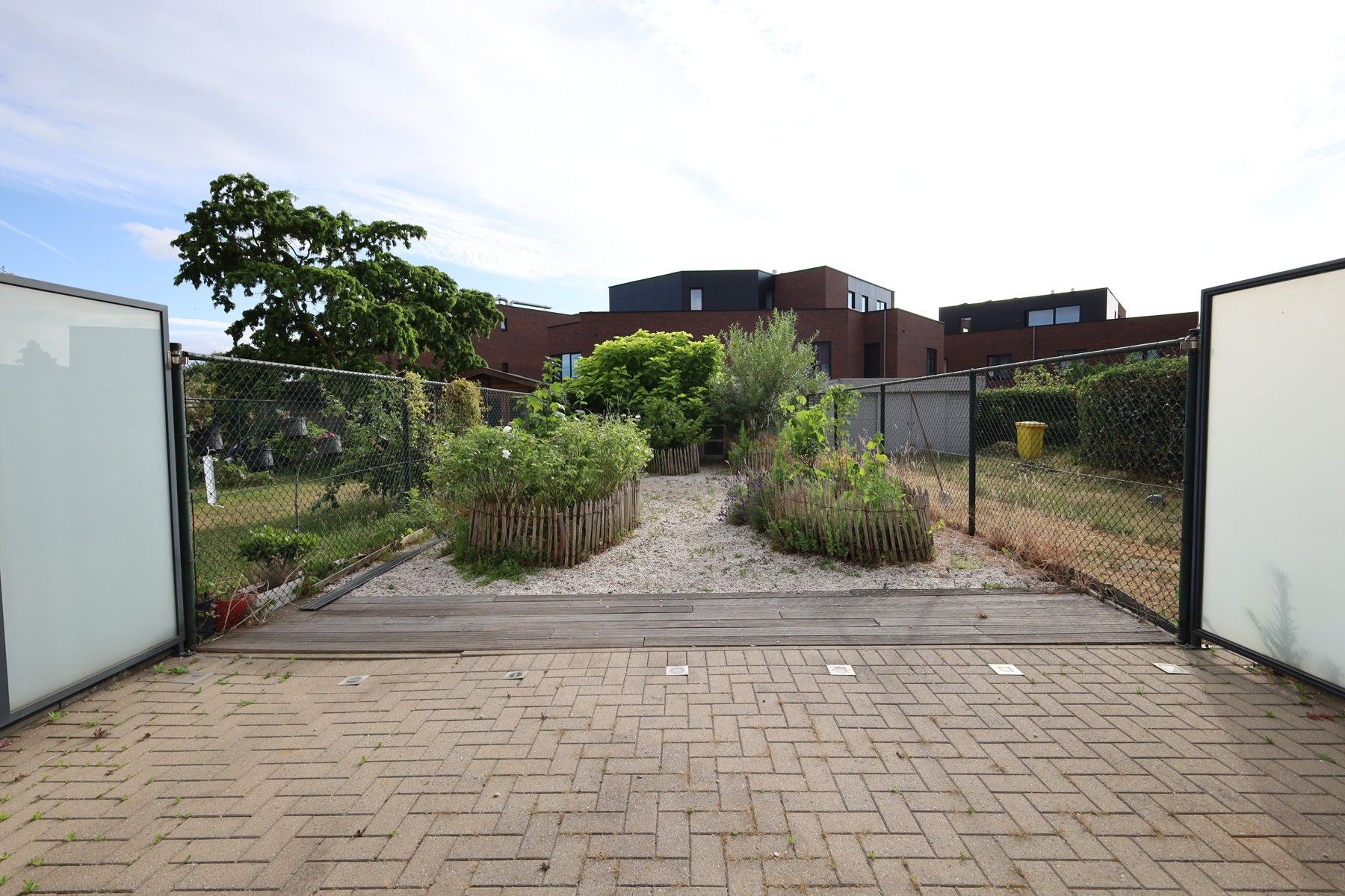 Gelijkvloers appartement met tuin, binnenautostaanplaats en kelder foto 15