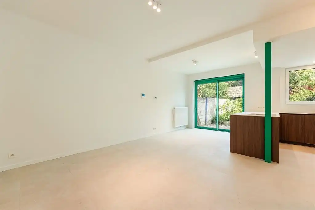 Gerenoveerd gelijkvloers appartement met zonnige tuin foto 5