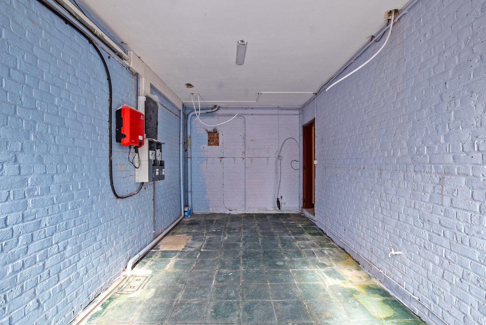 Ruime woning momenteel opgedeeld in 2 appartementen met inpandige garage en tuin op 240m². foto 12