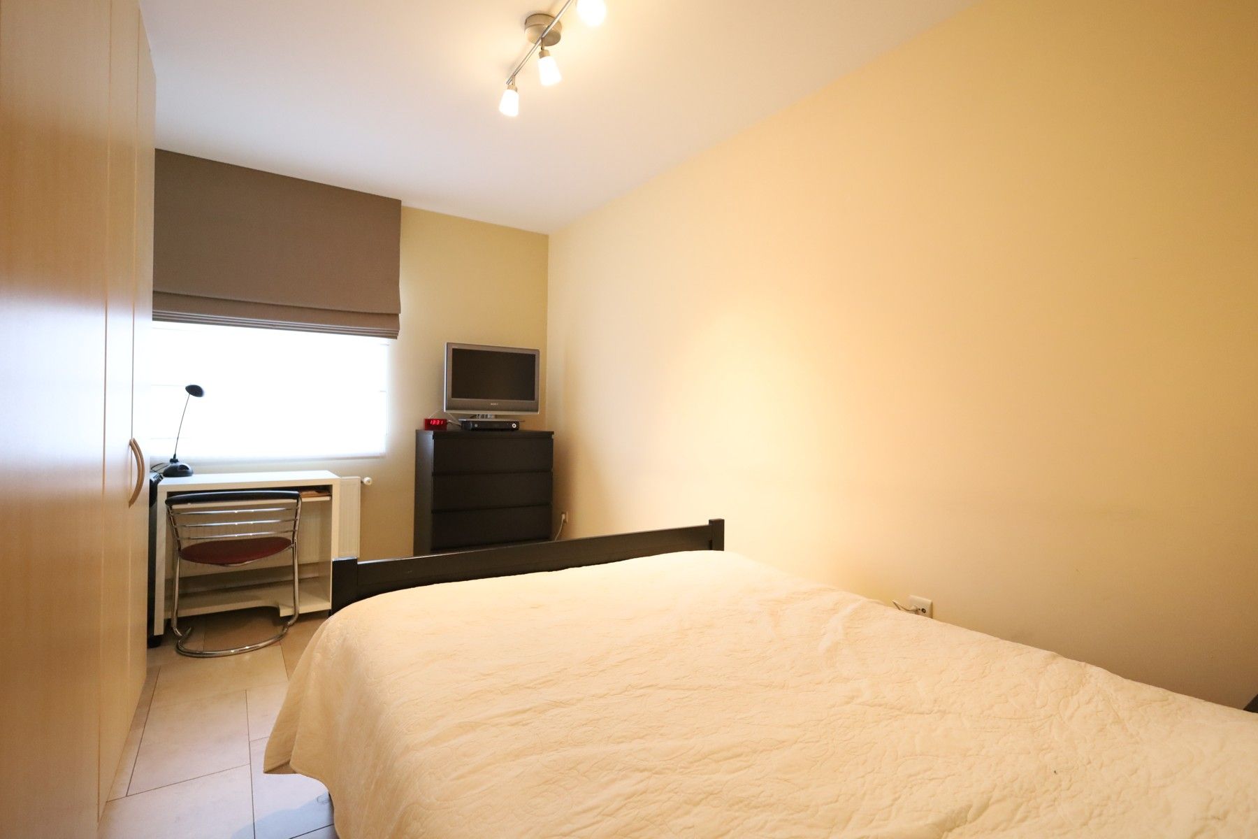 Gelijkvloers appartement met tuin, binnenautostaanplaats en kelder foto 10