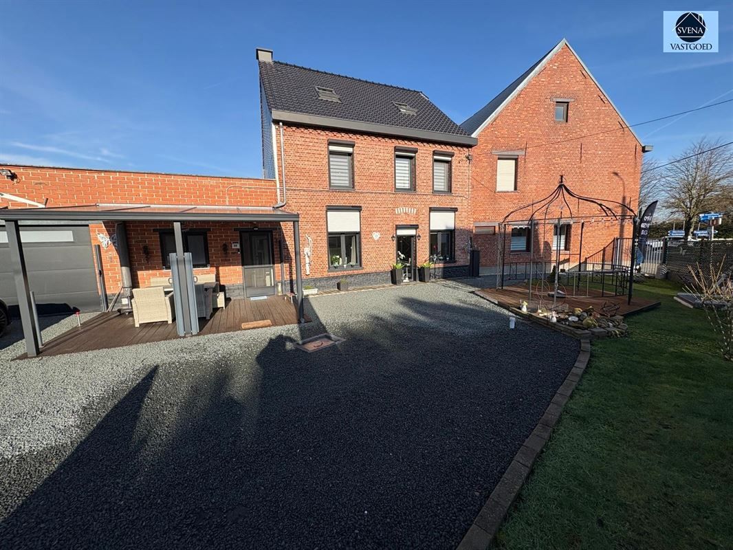 Hoofdfoto van de publicatie: ZEER GOED GELEGEN WONING MET GARAGE EN 4 KAMERS.