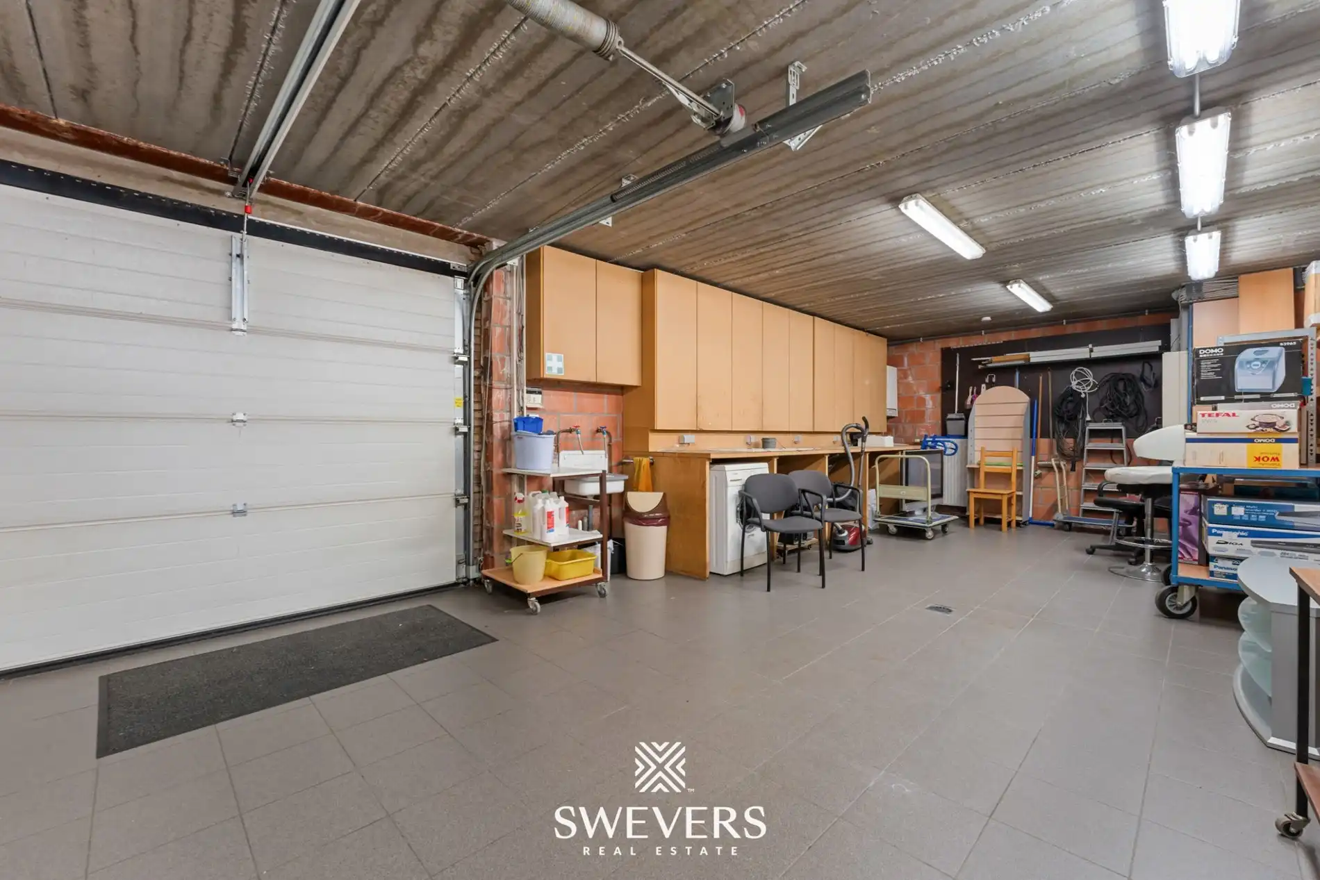 Opbrengsteigendom met handelspand, ruim appartement en uitbreidingspotentieel in hartje Heusden-Zolder foto 12