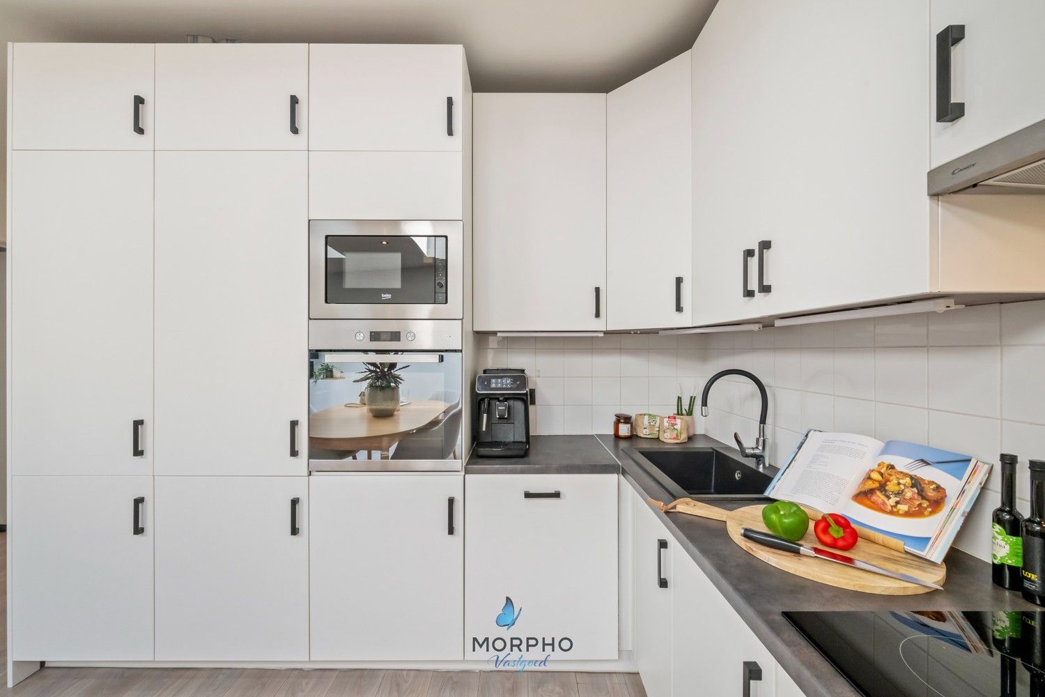 Instapklaar gelijkvloers appartement met 2 slpks, zonneterras en autostaanplaats. foto 3