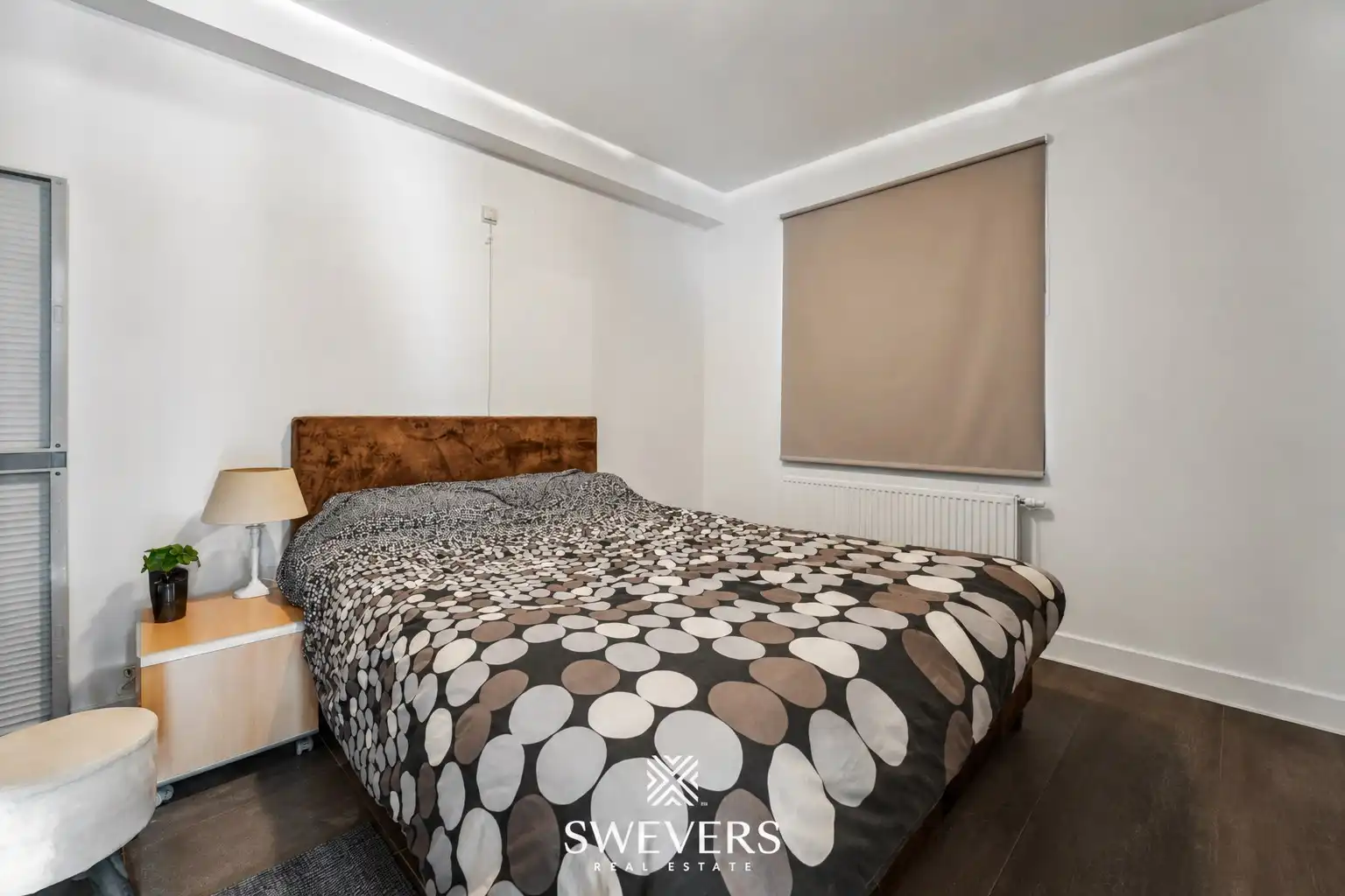 Instapklare gelijkvloerse studio met aparte slaapkamer, terras en parking in Geel foto 11