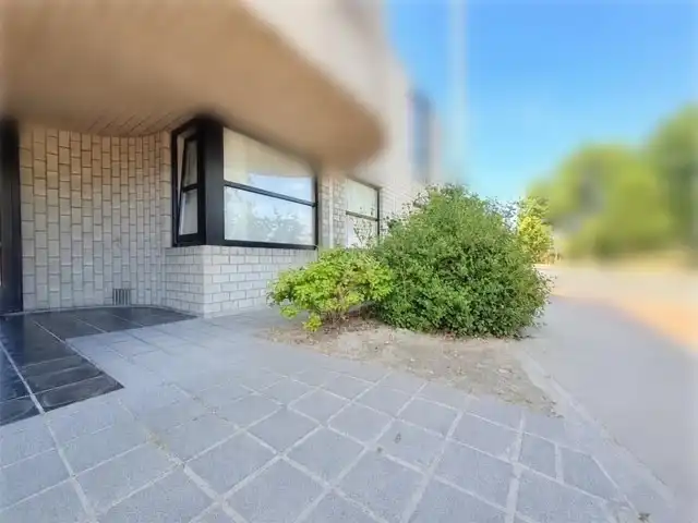 Gelijkvloers appartement met tuin en uitweg foto 8
