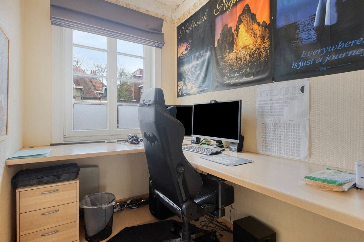 Charmante op te frissen woning met 4 slaapkamers en stadstuintje! foto 10