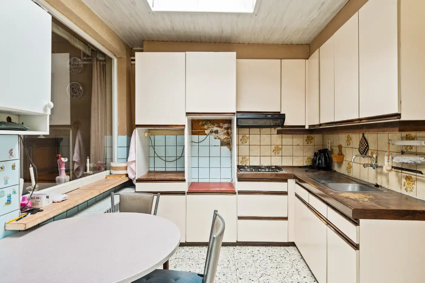 Te renoveren woning met 3 slpk., stadstuin en garage foto 8