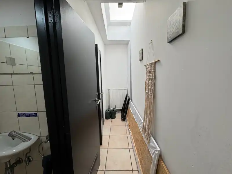 OPBRENGSTEIGENDOM, Handelspand met duplex appartement foto 9