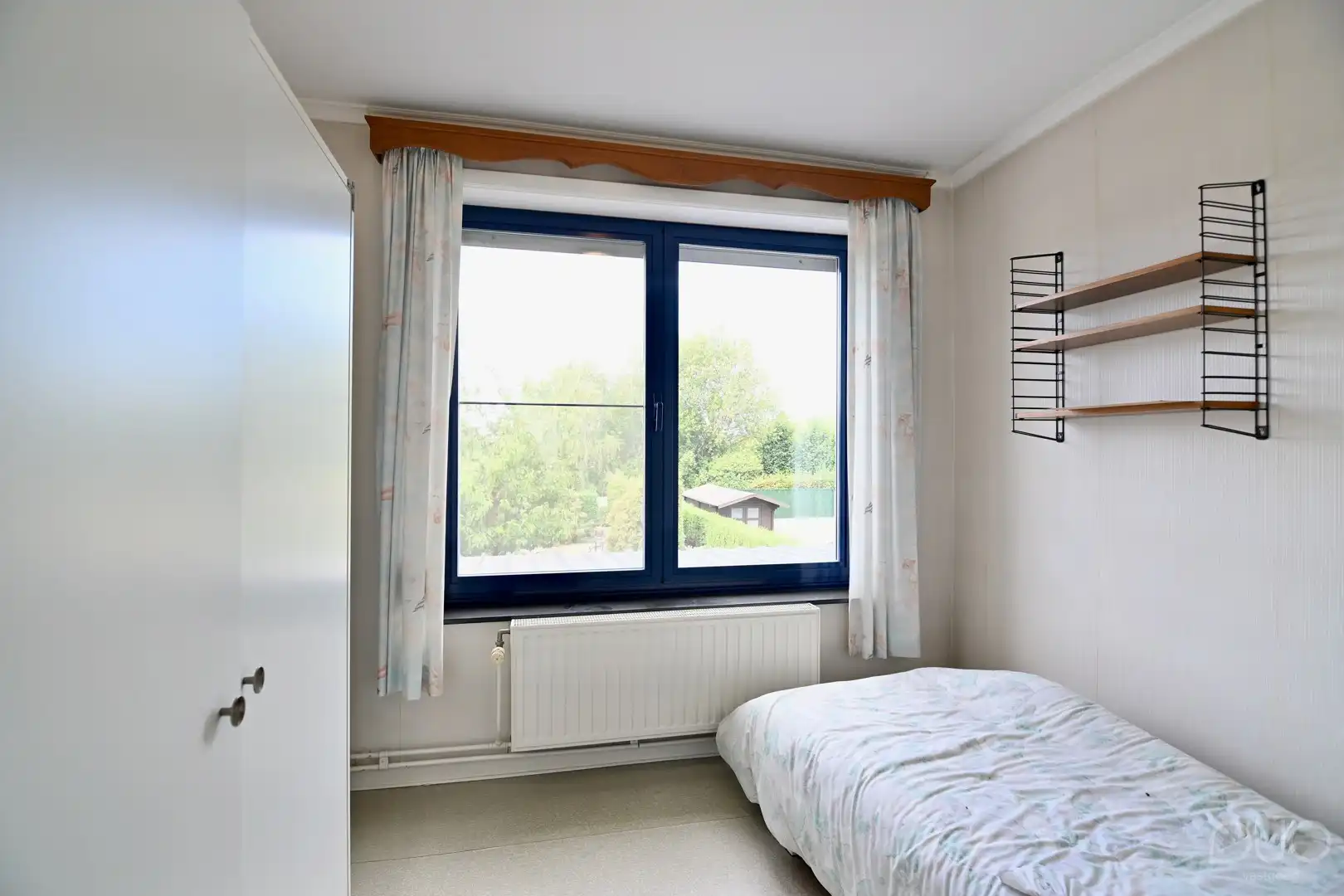 Ruime halfopen gezinswoning met prachtige westgerichte tuin foto 14