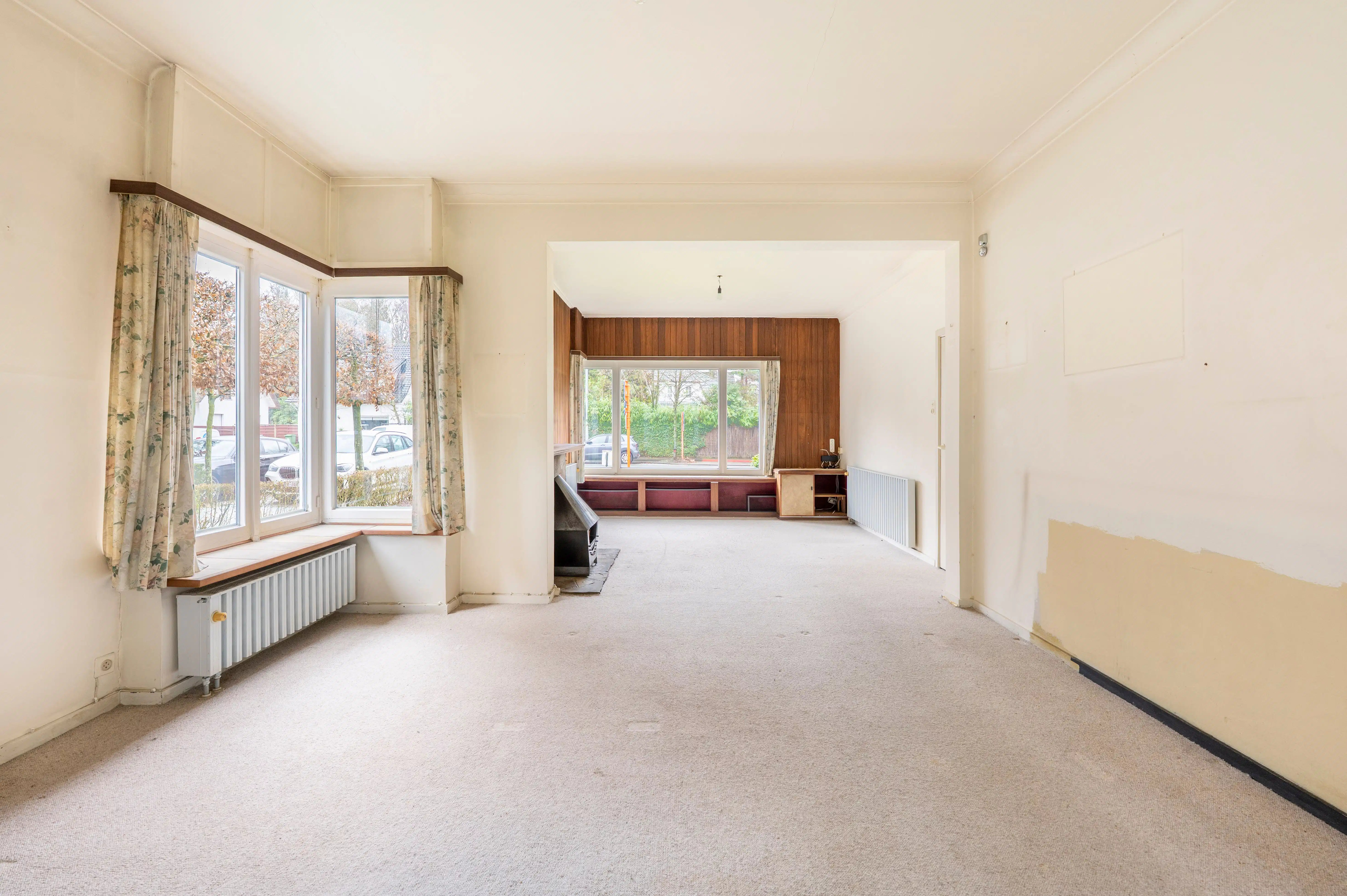 Halfopen bebouwing met veel potentieel, zonnige tuin en garage in Kapellen! foto 2