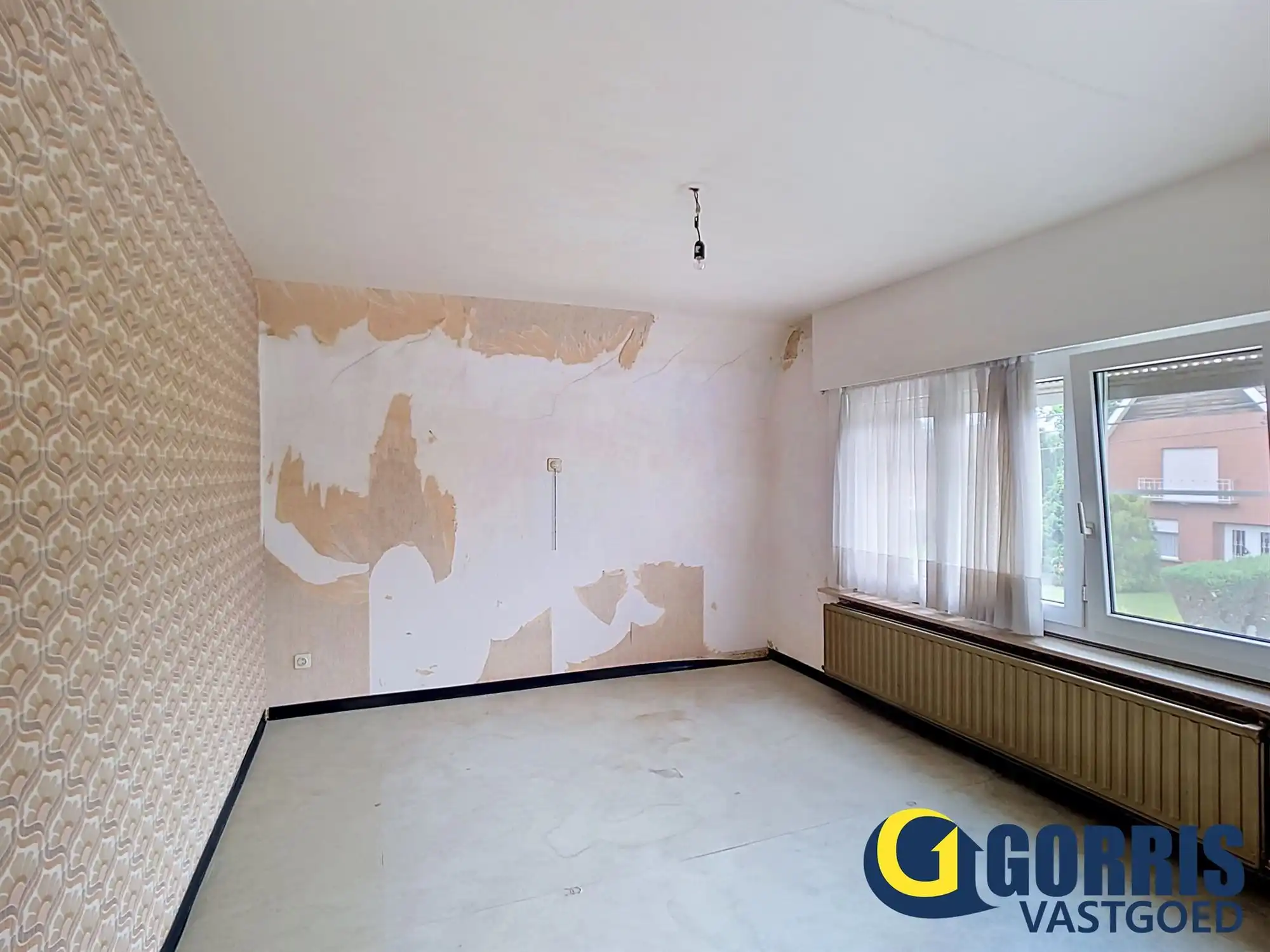 Te renoveren woning met ruime tuin in het centrum van Hulshout foto 4