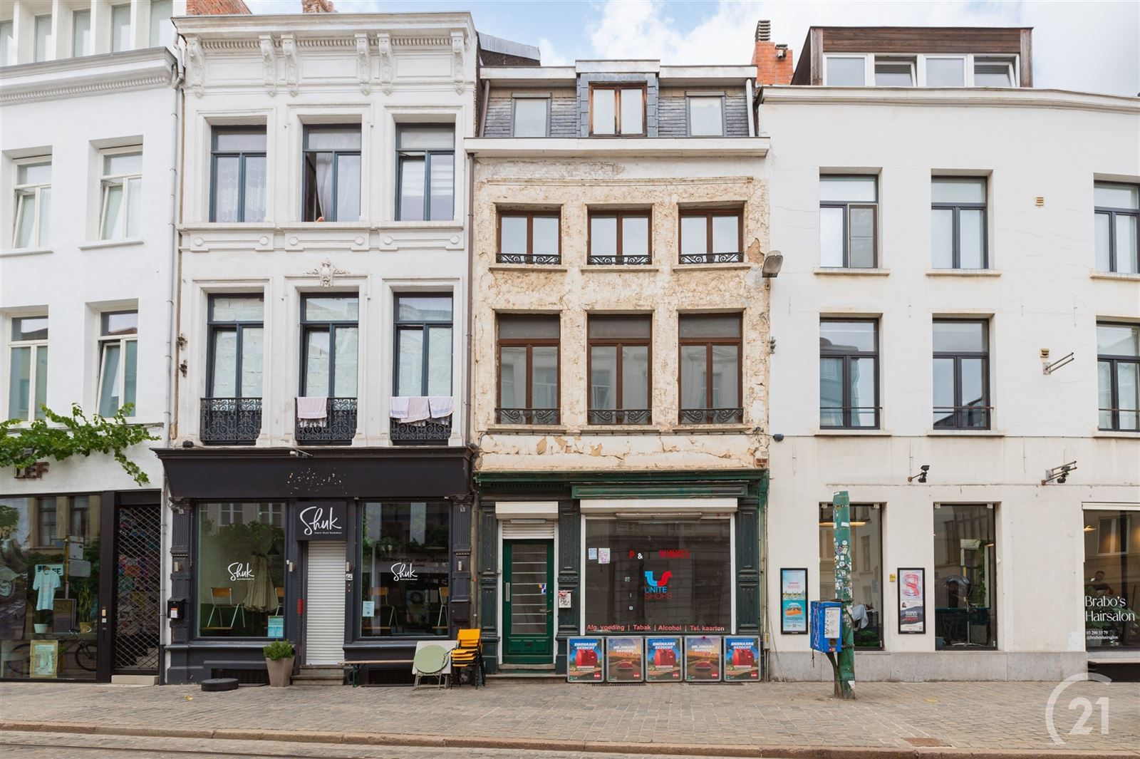 Opbrengstenwoning en handelsruimte foto 2