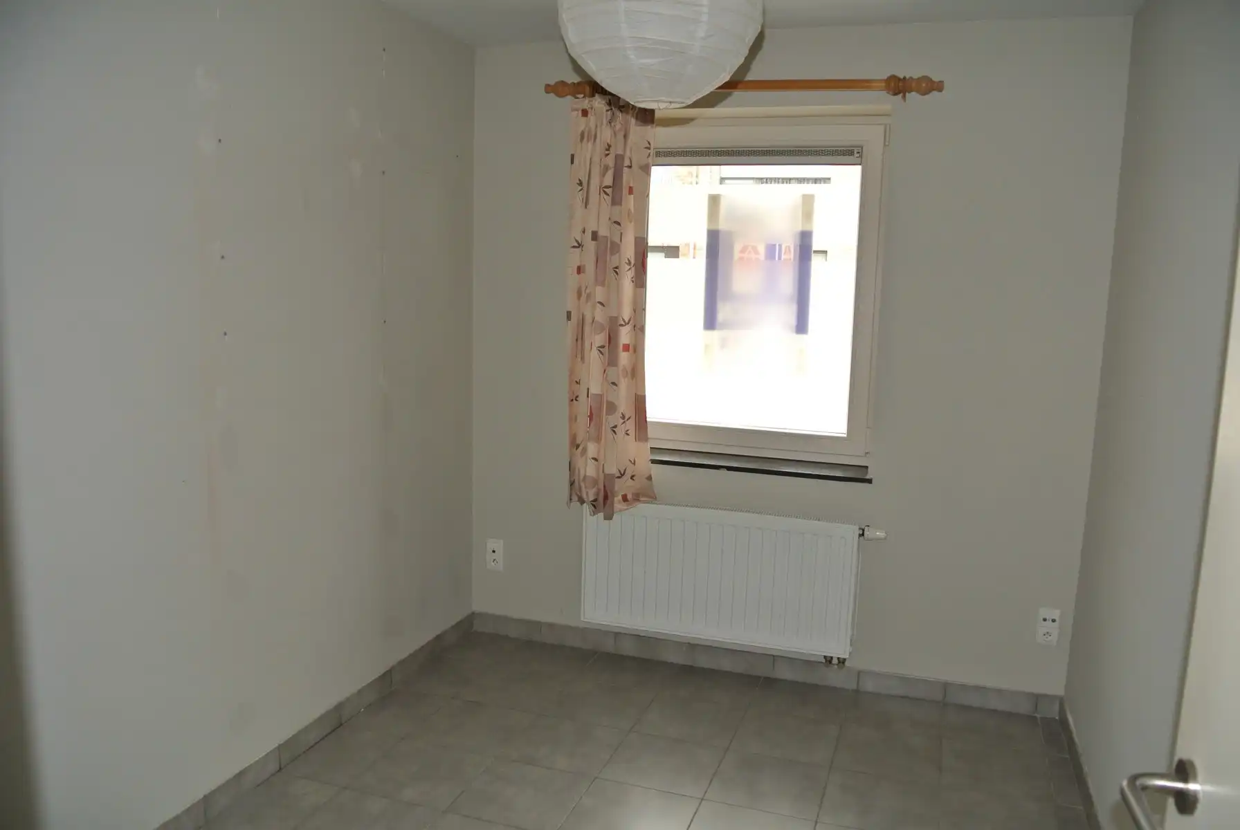 Gezellige gelijkvloers appartement  met 2 slaapkamers + terras en tuintje foto 11