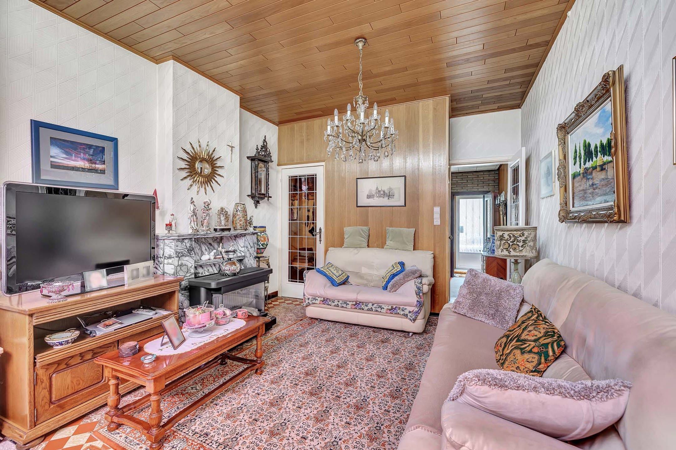 Te renoveren woning met tuin en perceel met garage foto 5