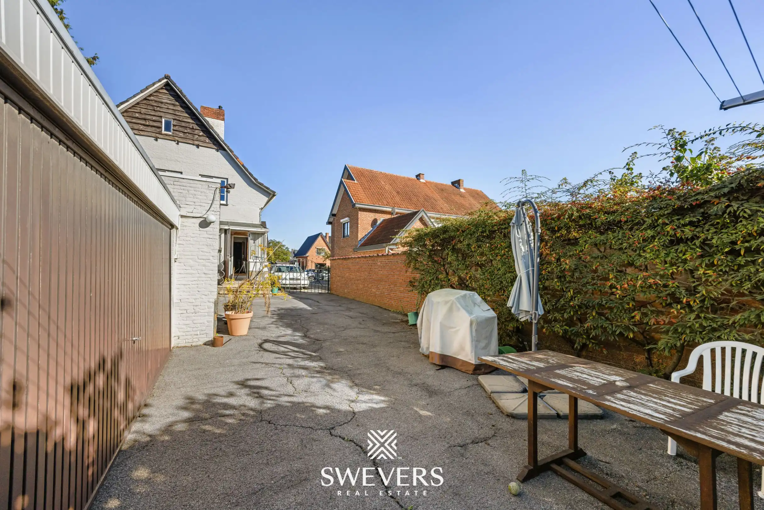 Open bebouwing in rustige straat met 4 slaapkamers, 2 badkamers en 2 garages in Beringen centrum foto 36