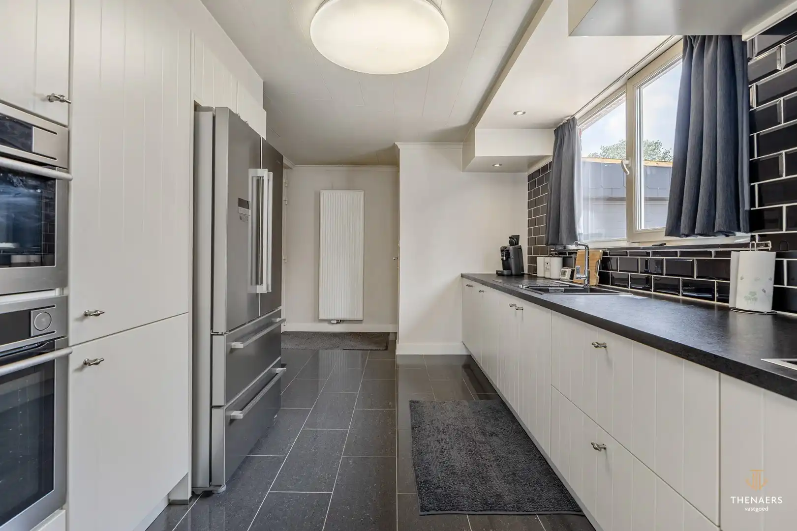 Gezinswoning met drie slaapkamers, garage en aangename buitenruimtes in het landelijke Opheers. foto 9